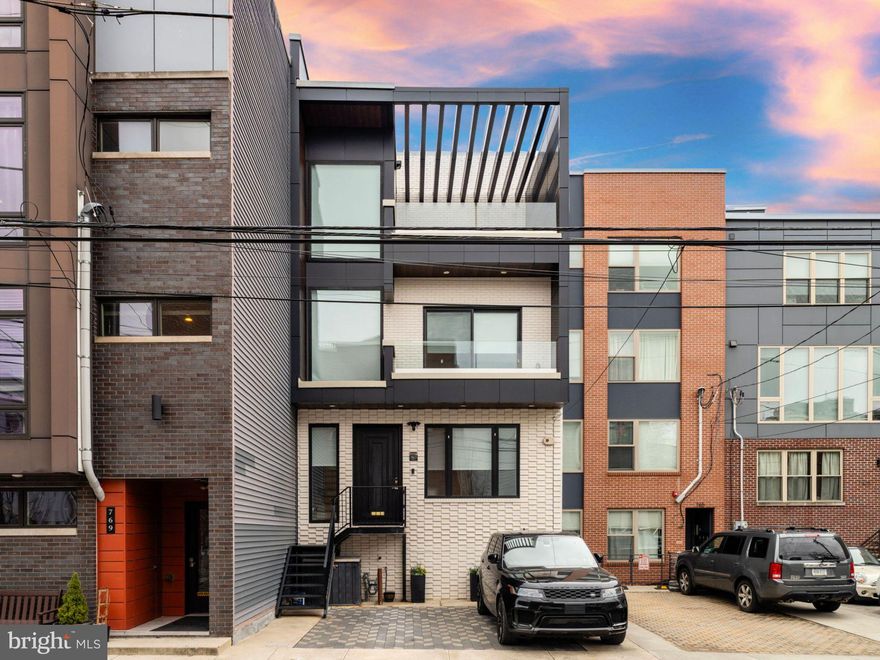 Finally a home that has it all - Location, size and parking! This custom home located on a desirable block right off of Fairmount Avenue was thoughtfully designed to make sure every modern need was addressed. The gorgeous facade welcomes you with private DEDICATED 2 CAR PARKING. As you enter this home you will be wowed by the unbelievable width and depth encompassing the living, dining and massive chef's kitchen with two large islands. The kitchen leads to a patio perfect for first floor grilling. The lower level features incredible ceiling height with heated floors, bedroom, gym and full bathroom. The second floor has amazing guest bedrooms, all drenched with natural sunlight. The top floor amazing features the luxurious primary bedroom with a HUGE private rooftop deck. Ascend one more level to the roof top deck which will host your summer parties overlooking the Philadelphia skyline! Although this home has everything you need, you are also one block away from all the action of Fairmount Ave. Schedule your tour now! Taxes and square footage is the responsibility of the buyer to have verified independently.