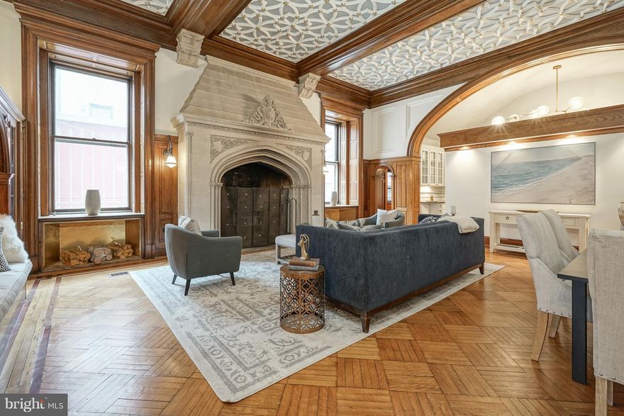 A true work of art; welcome to this one-of-a-kind Rittenhouse Square condo with deeded parking at historic Chandler Place. Built in 1903 for the Episcopalian Bishop of Pennsylvania, this magnificent home was designed by famed architect Theophilus Chandler and was eventually converted into 10 boutique homes. Boasting its own private front door entrance, exceptional original details have been exquisitely maintained to achieve the perfect blend of historic charm, craftsmanship and modern convenience. Ideal for entertaining, the visually stunning formal living area greets you with renovated parquet floors, soaring ceilings, large windows, intricate molding & woodwork as well as a fully functional and grandiose fireplace. The recently renovated kitchen boasts new granite countertops and stainless steel appliances including double convection ovens and white shaker style cabinets with plenty of storage. The parquet floors continue into the first floor bedroom which has its own en-suite bathroom and is complete with oversized windows which usher in an abundance of natural light. This bedroom would also be ideal as a den, library or home office. Built-in shelving, a fireplace and 15 foot ceilings highlight the impressive room. Take the grand, sweeping staircase to the master bedroom suite where you ll enjoy a large walk-in closet, decorative fireplace and en suite bathroom with a new double vanity. Conveniently, there is also a laundry area and additional rooms that could be utilized for a home office, storage or more walk-in closet space. This pet friendly home is perfectly nestled between both Rittenhouse Square, Fitler Square and blocks from the Schuylkill River Trail and dog park. Walking distance to hundreds of Philadelphia's top restaurants, shops and cultural icons in addition to quick access to 676 and 30th street station, this home's location offers premier access to all the best that Philadelphia offers.