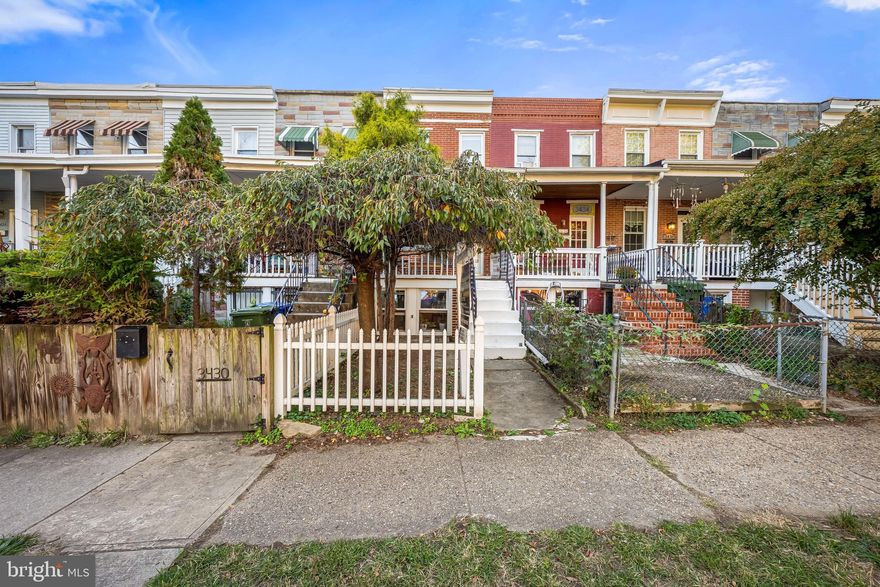 Nestled in the heart of Hampden, this beautifully updated three-story brick rowhome combines historic Baltimore charm with stylish, modern updates.  Enjoy peace of mind with brand-new updates throughout, including new windows, a new furnace, new water heater, new roof, and a brand-new front porch—all the big-ticket items are already taken care of.
Just steps from “The Avenue” and everything that makes this neighborhood one of the city’s most beloved, 3432 Roland offers a rare opportunity to enjoy walkable city living at its best.Step inside to find Open concept spacious living room as it  flows seamlessly into the kitchen, featuring new appliances including a brand new stove , and ample storage.  Cold storage rear porch functions as a pantry and mudroom helping you stay organized.Upstairs, you’ll find comfortable bedrooms and a half bath. The finished lower level offers flexible space for a guest room, home office, or media area, along with convenient laundry, storage, and a full bath. A ground level entrance and large windows make this feel more like main level living space than a basement.Outside, enjoy a welcoming extra large front porch, and small outdoor space in front and back. Just enough for a few plants to enjoy but not large enough to require a green thumb Located minutes from boutique shopping, award-winning dining, and local parks, this Hampden gem offers the true charm of Baltimore living — where historic character meets vibrant community.