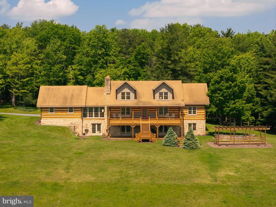 This property will truly take your breath away from the moment you pull in. The views seem never ending, no matter which way your turn, this private piece of paradise delivers. The sunrise and sunsets at this home are hard to explain just how beautiful they are. Upon entering the home, it just keeps impressing. The hearth beams and logs are stunning, the cathedral ceilings and abundance of windows make this home feel warm and inviting. Three levels of living space, a large loft area and two kitchen areas affords you plenty of room to entertain family and friends. The wood work with different species, wormy chestnut and cherry is another unique feature. The property sits on 71.65 acres which boasts a stream, pond and spring house. The attached two car and detached oversized four  car garage with a loft is enough space for vehicles, tractors, mowers and side by sides. A whole house generator, radiant floor heat and an outdoor wood furnace, this home will keep your comfortable year round. The large front deck, covered porch and Pergola are perfect spots to just sit and relax and take in the scenery. A property similar to this is very hard to find in Garrett County, a hunters dream or just a private paradise to call your own. Call quickly for a tour, it won't last long!