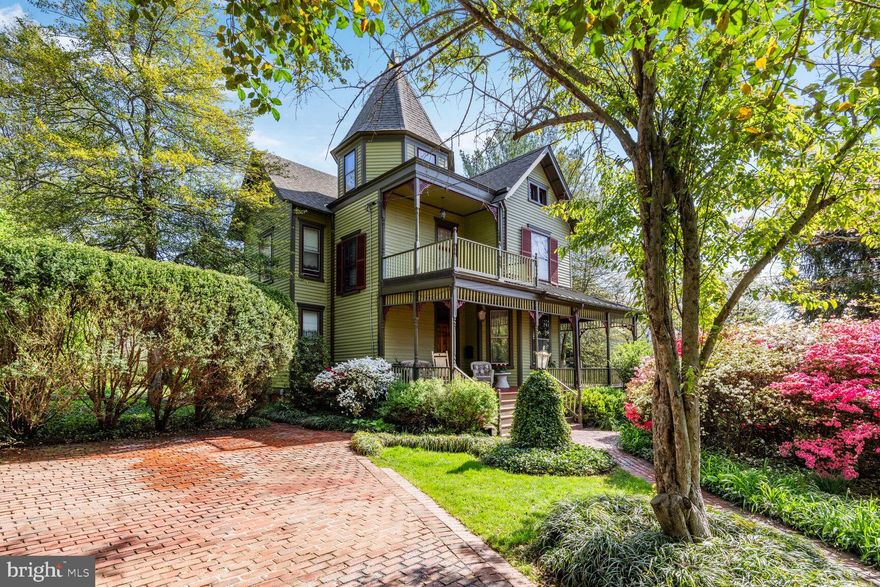 Stunning Victorian on a double lot in the heart of Kensington's historic district.  Rare opportunity to own one of the most beautiful historic homes in the heart of Kensington’s historic district.  Built in 1898 and in meticulous condition, this is a must see in person! This Queen Anne style architectural gem is beautifully sited on a double, .40-acre lot and has magnificent custom features not found in homes today- fabulous millwork, custom built in china cabinet, pocket doors, original fireplace mantels, front and back staircases, heart pine floors, transom windows, glass doorknobs, soaring ceilings , historic light fixtures, even a secret room! Ten foot ceilings  on the first floor, nine foot ceilings on the second floor. Tour in person to see all rooms and the special features. The main level features a stately foyer with coat closet and gorgeous staircase, formal living room with bay window and gas fireplace, family room with fireplace and door to side deck, grand formal dining room large built in china cabinet and door the back porch, full bath, and masterfully renovated kitchen with custom cabinetry, Silestone countertops, stainless steel appliances, tin ceiling, pantry, and back stair to the second floor. The upper level includes four large bedrooms, hall closet, large renovated bath and stairs to the attic with lots room for storage and play. The lower level is a wonderful surprise with good ceiling height, ceramic tile floor recreation/guest room areas, full bath , outside egress, and laundry area with front loading washer and dryer. Please see floor plans. The outdoor living areas are amazing- large front porch, side porch , and rear covered porch , and a private brick patio.  The established gardens feature more than fifty mature flowering trees and shrubs. Upgrades include a 50 year shingle architectural  roof with copper stand seam porch roofs and copper downspouts, new sewer and water lines, electrical 200 amp heavy up and electrical upgrades, relining  of chimney flues, newly constructed chimney, new master water valve shut off,  new hot water heater in 2023, dual zone AC, exterior recently repainted  & more! location, location! Walk to the heart of Kensington and all it has to offer- restaurants, shops, multiple parks, weekly Farmer’s market, Noyes Children’s Library, Babycat Brewery & more. Just minutes to the entertainment and shopping districts of Chevy Chase Lake and Pike and Rose. A commuter’s dream close to two Metro shops, downtown Bethesda and just a mile to the Beltway. You will love the community spirit of Kensington.   Prepare to fall in love with this very special home, property, and neighborhood!