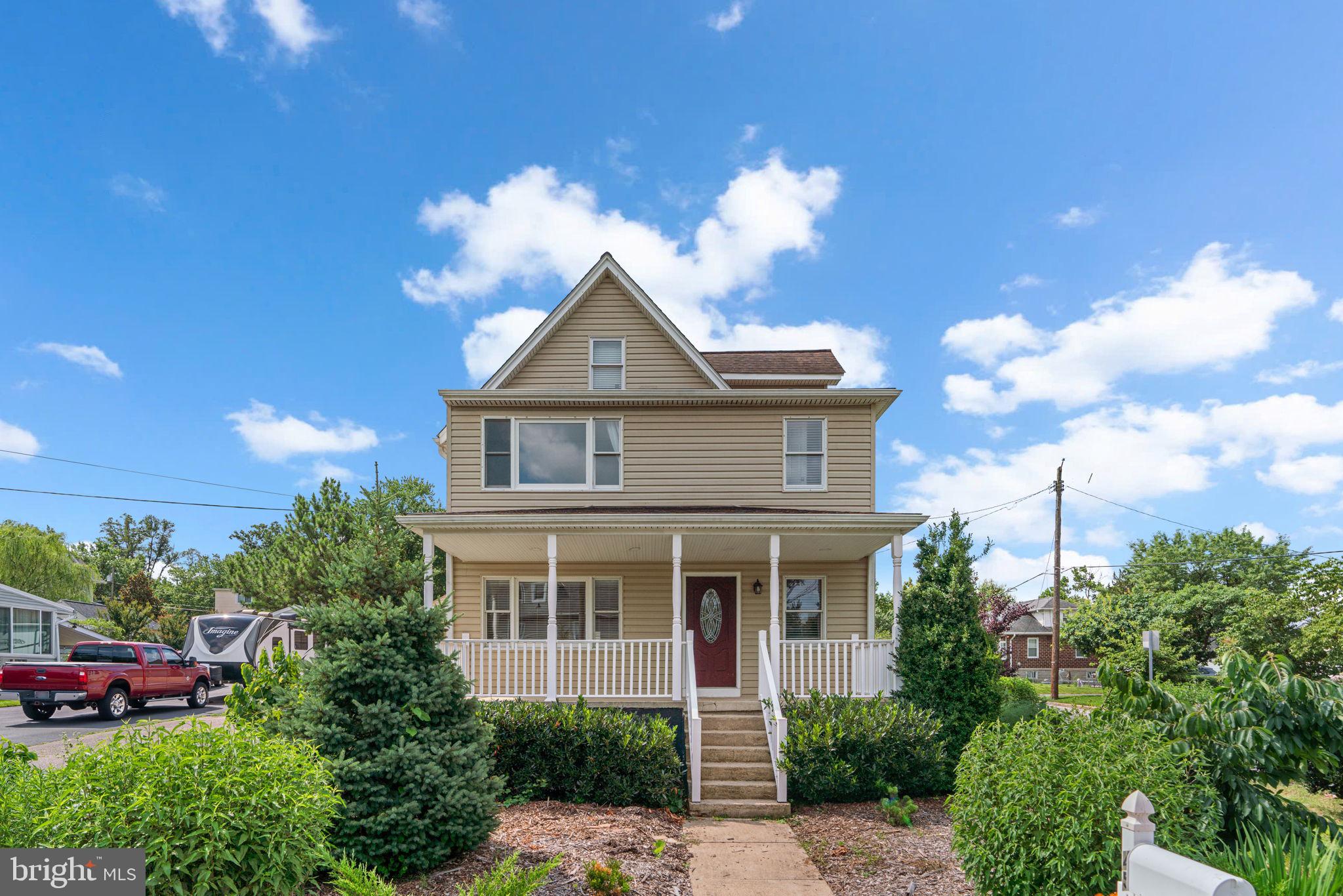 Must see 4 level updated single family colonial on a prime corner lot with an oversized detached 2-car garage within walking distance to the MARC Train commuter station. Endless upgrades include: tall 9' ceilings; replaced vinyl siding; natural gas boiler (2018); natural gas water heater (2015); remodeled eat-in kitchen w/replaced cabinets, granite counters, replaced appliances, tile floors and access to sunroom; gleaming hardwood floors on the main level; bedroom w/private en suite bathroom on the 1st floor; remodeled 2nd full bathroom on the 1st floor w/soaking tub; full sized front loading w/d on the 1st floor; 2nd level w/3 bedrooms, 2 full bathrooms and 2nd kitchenette w/2nd front loading washer/dryer; primary bedroom on 2nd floor w/built-ins, walk-in closet and remodeled en suite full bathroom; upper level loft area is an ideal home office, playroom or guest suite; basement access for storage and utilities; relax on the front porch or rear deck; massive, oversized detached 2-car garage w/work shop and 2nd floor storage. An amazing location to restaurants, shopping and major commuter routes. This home has endless potential!