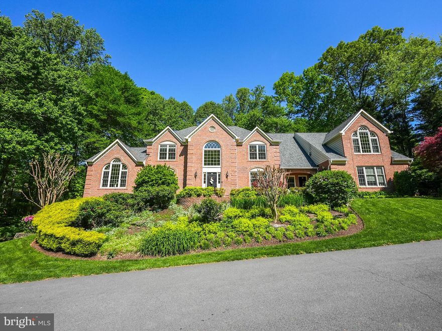 Elegant Colonial in Fairfax Station – A Private Retreat with Luxurious Upgrades

Welcome home to an impeccably maintained and stately Colonial home nestled on a private, wooded 0.84-acre lot in the sought-after Fairfax Station community, Fairview Woods. Offering 5 bedrooms, 4.5 bathrooms, and a 3-car garage, this exquisite home seamlessly blends classic elegance with modern updates, making it an exceptional find for those seeking space, privacy, and convenience.

Grand & Inviting Living Spaces
Step into the foyer, where gleaming hardwood floors extend throughout the main level. A sophisticated floor plan, leading to formal living and dining rooms, is perfect for entertaining. The sun-drenched conservatory or sunroom offers endless possibilities, whether used as a reading area, an afternoon tea, a yoga studio, or a music room. This offers even more living space.

The gourmet kitchen with stainless steel appliances, granite countertops, and custom cabinetry includes a butler’s pantry, a spacious pantry, and an eat-in dining area. The mudroom and laundry area are perfectly located next to the kitchen and private second entrance attached to the mudroom with access to the 3-car garage. 
The eat-in kitchen flows effortlessly into the soaring two-story living room, complete with a fireplace, Palladian windows, and direct access to an expansive Trex deck, which is ideal for entertaining or simply enjoying the peaceful, tree-lined surroundings.

Luxurious Bedroom Retreats
The upper level features four spacious bedrooms and three full bathrooms, including a stunning primary suite with a vaulted ceiling, dormer windows, a private fireplace, and three walk-in closets. The spa-like primary bathroom is a showstopper, boasting dual vanities, a soaking tub, a separate shower, a warming towel rack, heated flooring, and a private water closet. A secondary bedroom includes an ensuite bath, while two additional bedrooms share a jack-and-jill bath.

Exceptional Lower Level – Walkout Basement with Additional Living Space
The fully finished walkout basement offers an additional bedroom, a separate den, a full bathroom, a spacious recreation room with a fireplace, which is the perfect setup for entertainment or guest quarters. Don't forget the impressive Theater Room and workout alcove! Do you need extra storage? There are plenty of storage spots! The lower level opens to a beautifully hardscaped patio providing a tranquil outdoor retreat.

Unbeatable Location & Community
This home is tucked away in a peaceful yet highly accessible neighborhood near the Country Club of Fairfax. It offers convenient access to major commuting routes, including Fairfax County Parkway, I-66, I-95, and I-495.  Commuters will love the proximity to Burke Centre Train Station, and the VRE. Outdoor enthusiasts will appreciate the nearby Burke Lake Park, W&OD Trail, and scenic neighborhood trails.

A Rare Opportunity in Fairfax Station
This home offers a rare combination of elegance, functionality, and privacy in one of Northern Virginia’s most desirable locations.

Estimated Dates:
*Triple Zone: HVAC #1 serves the basement (excluding the bedroom) & main level, HVAC #2 serves the 3rd level (bedroom level), and HVAC #3 (2022) serves the conservatory/sunroom and the bedroom in the basement
*Roof 2021 
*Dishwasher 2024
*Fridge 2022
*Siding 2021
*Trex Deck 2021
*Septic last served by Great Falls Septic in 2022 per FFX Cty records