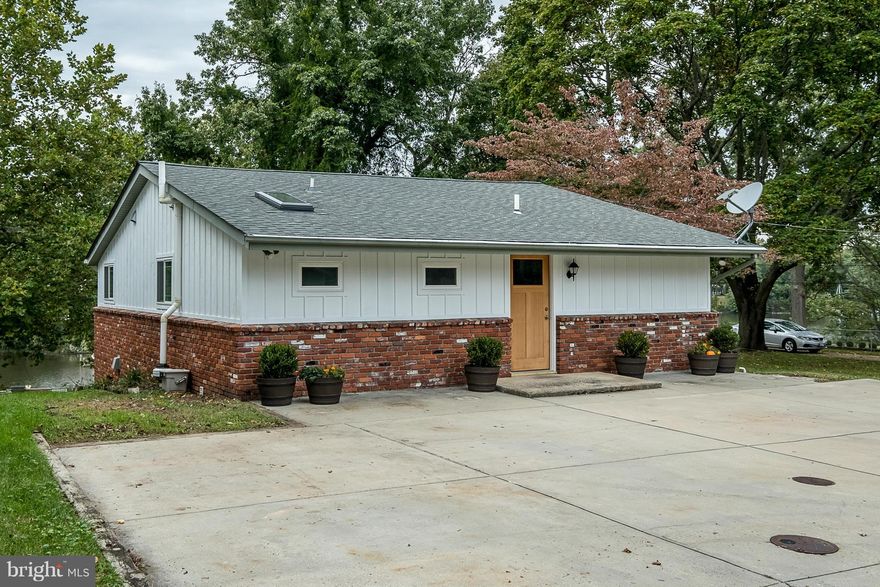 WATERFRONT - private beach, new bulkhead, 70' pier w/ 5' depth. 3 BR, 2300 SQFT home w/outstanding renovations! Kitchen w/ custom cabinets & SS appliances, hardwood floors, trim/doors, windows & utilities - all new! Enjoy creek life & the Magothy - fish/crab from your pier, paddle board in the cove, kayak to The Point! Walk to park & close to shopping.  This is a must see!  Broadneck schools.