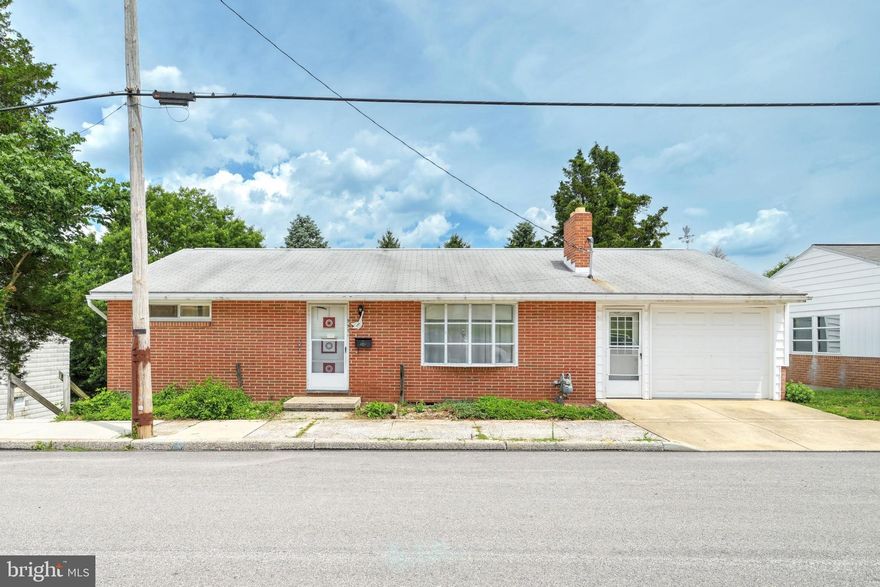 Charming Brick Rancher in Dallastown Schools! You will not want to miss the opportunity to make this gem shine again. Once loved by the same owners since 1960 this home has seen many of family dinners, birthday parties, and holiday gatherings.  The home features 3 bedrooms, 1 Full and 1 Half Bath. The 3rd bedroom was outfitted with a handicap accessible shower to accommodate an aging loved one, this could remain if there is a need or it could be removed.  The vintage bathroom is fun with its aqua tile and funky Formica countertop, realizing this will probably be updated but lets take a moment to appreciate the décor.  The living room has a lovely picture window and gas fireplace with built-in cabinets. In the Basement you find the recreation room with a faux-stone accent wall, woodstove and dry bar. Its a great space to cozy up in the winter and whip up some drinks at the bar, there is even a spot for your record player.  Step into the former Beauty Salon and dream up what this space could become, complete with a half bath and a hair washing sink.  Don't miss the large workshop and storage room on the other side of the basement.  Outside there is plenty of room to entertain on the lower deck, imagine all of the possibilities to make it your own. Build some equity and make it your own or turn it in to an investment, whatever you decide there is so much potential in this home.
