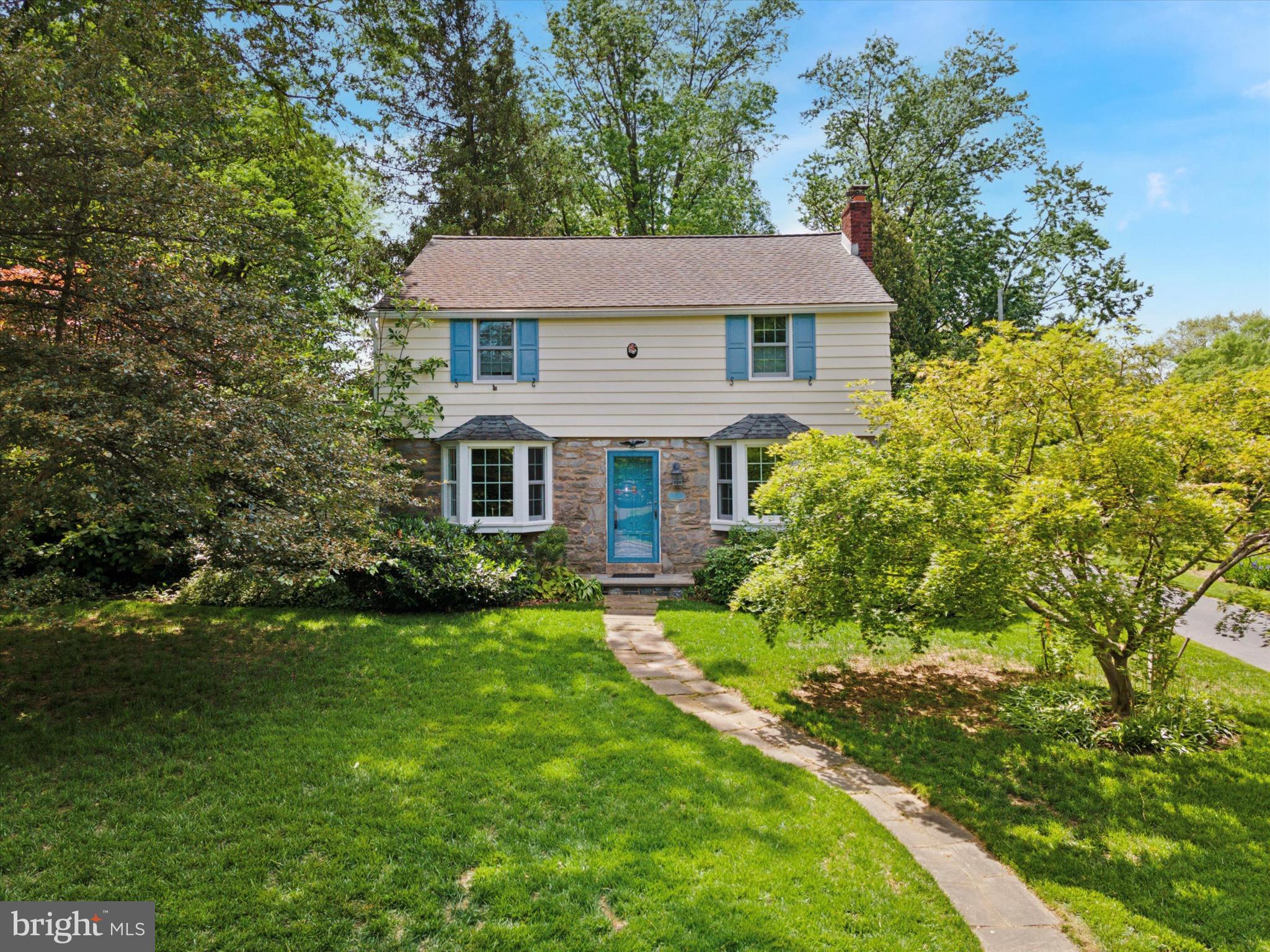 Welcome to 711 Avondale Rd—a rarely available, expanded Colonial in the sought-after community of Chesney Downs. Offering 4 bedrooms, 2 full baths, and 2,248 square feet of thoughtfully designed living space, this home seamlessly blends charm, comfort, and functionality with a layout ideal for entertaining.
Beautiful hardwood floors run throughout the entire home, except in the breakfast/mudroom, where a stone floor adds character and durability. The inviting living room features a bay window, crown molding, and a cozy gas fireplace. A formal dining room—also with a bay window, chair rail, and crown molding—flows effortlessly into both the kitchen and the spacious family room. The family room addition boasts a tray ceiling with recessed lighting, custom built-in cabinetry, and French doors that open to a large flagstone patio. The updated kitchen is a chef’s delight with cherry cabinetry, stainless steel appliances, ample counter space, and a bar/prep sink. Adjacent to the kitchen, the breakfast/mudroom addition offers a large coat/storage closet and additional access to the backyard. A full bath with pedestal sink and stall shower completes the main level. Upstairs, you’ll find a spacious primary bedroom, three additional bedrooms, and a full hall bath. The full, unfinished basement includes a laundry area and offers endless potential—whether you envision a home gym, studio, workshop, or additional living area. Outside, enjoy the private backyard from the expansive flagstone patio—perfect for outdoor dining or relaxing in a serene setting. A two-car garage (one shortened to accommodate the first floor full bathroom) completes this exceptional property. Conveniently located near shopping and restaurants in Flourtown and Chestnut Hill, major transportation routes and an easy commute to Center City.