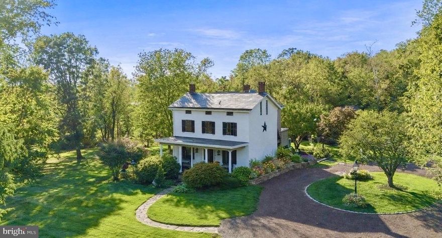 3307 Windy Bush Road—an elegantly refreshed Bucks County estate offering a rare harmony of historic character, natural beauty, and contemporary comfort. Ideally located just minutes from downtown New Hope, this private retreat is set amid idyllic grounds featuring a newly installed saltwater pool, a fully restored and climate-controlled studio, curated gardens, and a thoughtfully converted barn—capturing the essence of refined country living.
Beyond the threshold, the main residence reveals a seamless blend of timeless charm and inspired modernization. Bright, airy rooms flow effortlessly, showcasing newly restored hardwood floors, charming architectural details, and striking windows that frame breathtaking views of the surrounding landscape—enhanced by all-new landscaping designed to open sightlines and highlight the property from every angle.
The avant-garde kitchen is a true showpiece, appointed with sleek cabinetry, new Italian marble countertops, a brick backsplash, and new appliances. Perfectly integrated with inviting dining and living areas, the space is ideal for both everyday living and stylish entertaining. All bathrooms throughout the home have been fully renovated, reflecting a cohesive blend of luxury and modern design.
The primary suite is a serene sanctuary, featuring a private dressing area, a romantic Juliet balcony, and a luxurious marble bath complete with a soaking tub and glass-enclosed shower. Two additional bedrooms share a completely new Jack-and-Jill bathroom, while the top floor unveils exceptional bonus space—three generous rooms with a full bath—perfectly suited for guest accommodations, home offices, or creative pursuits.
Outdoors, extensive upgrades elevate everyday living, including stone walls and walkways, a fenced garden, a newly constructed driveway, a whole-house generator, and professionally redesigned landscaping that enhances privacy while showcasing panoramic views from every vantage point.
The renovated barn offers remarkable flexibility, featuring an impressive new kitchen, a bedroom with poolside views, and an updated full bath with laundry—making it an ideal guest retreat, entertaining venue, or extended living space for friends and family.
Just beyond, the third structure, a restored studio with heating and air conditioning provides a versatile environment for artistic endeavors, a gym, home office, or private wellness retreat.
Together, the elegant main residence, turnkey barn, and restored studio form an exceptional Bucks County estate—rich in character, private yet connected, and beautifully situated within the esteemed New Hope–Solebury School District. Moments from the cultural heart of downtown New Hope and enhanced by meticulous improvements, this country-chic compound affirms that true refinement does indeed have an address.