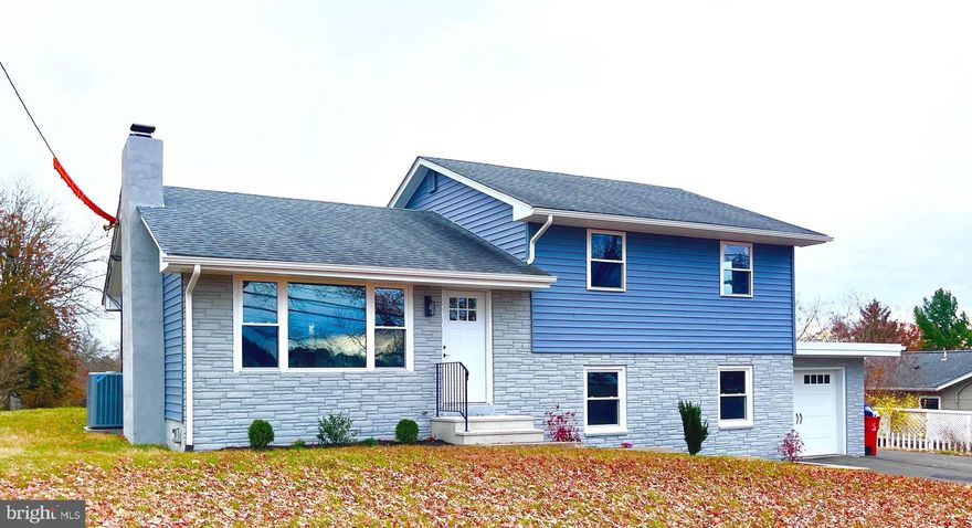 Fully Renovated and Move-In Ready! Discover a beautifully rehabbed multi-level home that seamlessly blends modern amenities with timeless charm. This stunning residence offers the perfect combination of comfort and style just across from Pottsgrove High School and Ringing Rocks Elementary School. The beautifully refinished hardwood floors add an air of elegance and sophistication to the entire home. The main level boasts a fully renovated kitchen equipped with shaker cabinets, granite countertops, and a generously sized island. Enjoy recessed lighting, pendant lights over the island, and brand new stainless steel appliances, including an electric range, microwave, dishwasher, and refrigerator. This bright and open kitchen is perfect for meal preparation and entertaining. Main level also boasts a wood burning fireplace in the living room. The upper level features three bedrooms, each with refinished hardwood floors, overhead lighting, and an abundance of natural light from new windows. A brand new full bathroom showcases a ceramic tile floor and a tiled shower/bathtub. The lower level includes a spacious laundry room and a large family room featuring dimmable recessed lighting. The completely updated bathroom offers floating shelves and a tiled shower, along with new vinyl plank flooring throughout. Comfort and efficiency with the newly installed central A/C with heat pump provides year-round comfort and energy-efficient dual heating. Existing oil heat is complemented by brand new baseboard heater covers throughout the home. A smart Wi-Fi home climate control unit has been installed, along with a new Tyvek home wrap beneath the new siding for maximum energy efficiency. All new energy-efficient double-hung windows and replaced exterior doors enhance the home’s aesthetic appeal while improving insulation and security. A newly installed garage door with remote access and newly replaced interior doors, including closet doors, augment convenience. A barn door has been installed in the basement to separate the laundry room from the unfinished area. You will enjoy the outdoor space with the newly installed vinyl siding that not only elevates the home's curb appeal but also ensures durability against the elements. A spacious backyard presents endless possibilities for outdoor entertainment, gardening, or simply unwinding in your private oasis. The front yard has been beautifully landscaped with two sizable flower beds, while a large backyard shed offers additional storage for tools, outdoor equipment, or recreational gear. Additional storage available in the easily accessible attic space. A convenient one-car attached garage provides space for your vehicle and extra storage options. Don’t miss your chance to make this home yours and embrace a lifestyle of comfort and convenience. Seller is also the listing agent. Schedule a viewing today and step into your new haven!