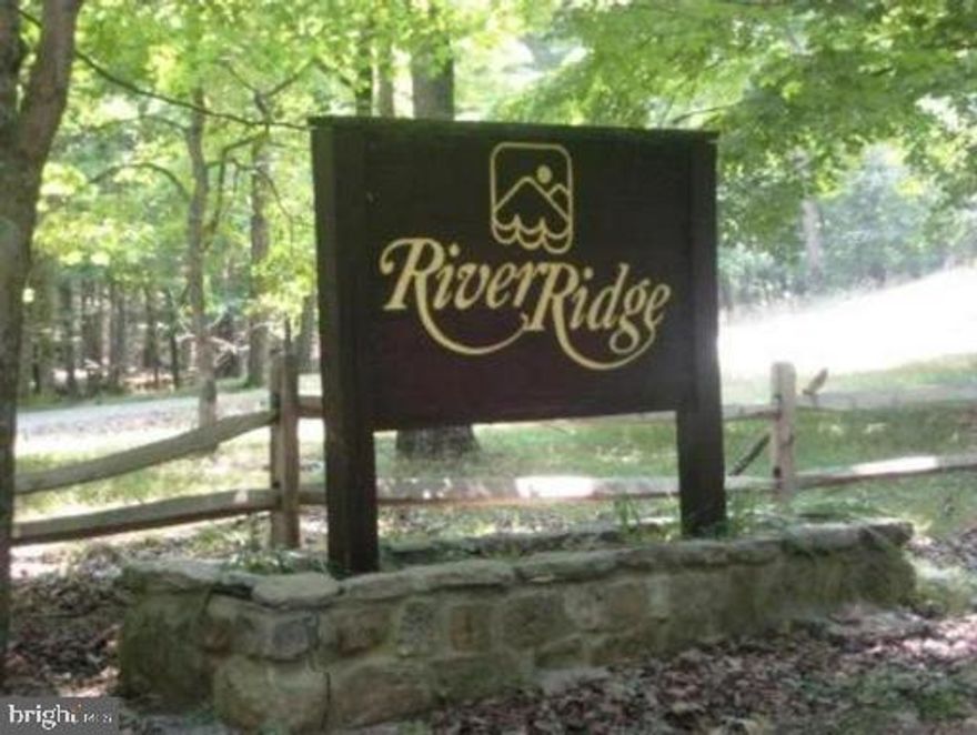 Residential building lot on 7.38 acres in River Ridge gated Community on the Cacapon River in Wild, Wonderful WV. Lovely mountain views with close easy access to the river. The community boasts of its common area front lot on the Cacapon River. Boat storage, picnic tables, grills, and restrooms. Owner financing for qualified buyers. Come be in the mountains and on the water. Just reduced price.