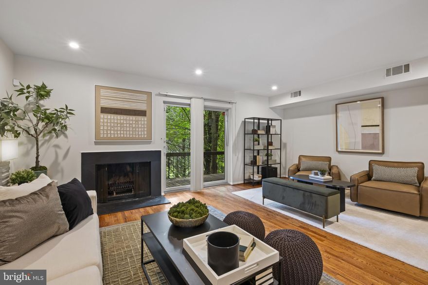 Tucked away in a peaceful, established neighborhood surrounded by mature greenery, this contemporary-style home offers privacy, comfort, and great amenities year-round. Inside, hardwood floors run throughout an open yet well-defined floor plan that gives the space a natural rhythm while a cathedral height ceiling and skylights above the main staircase create a sense of vertical space. The kitchen has a “cheffy” feel with a grill-top 36” range and a large range hood, granite countertops and stone backsplash. The living area with a wood burning fireplace opens to a generous deck.  Upstairs you’ll find three spacious bedrooms, including a huge primary suite with a large walk-in closet, balcony and a private en suite bathroom.  The finished lower level family room has its own wood burning fireplace and sliding glass doors that walk you out to a covered patio. A generous laundry area and workroom offer tons of storage.  Enjoy summer days by the swimming pool or on the tennis courts and then cozy up in front of one of two woodburning fireplaces in the fall. Come home to a place that feels like a retreat yet is only moments away from the shops in Mt. Washington and Quarry Lake, I-83 and 695.