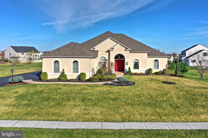 Here is the custom built rancher you've been waiting for!  This home built by Jeff Henry has so much to offer.  You will love the 10' or higher ceilings and custom trim work throughout.  The eat-in kitchen is perfect for entertaining!  It features hardwood floors, granite counter tops, tile back splash, stainless steel appliances, along with a breakfast bar, center island and separate dining area.  The kitchen opens to a spacious great room with triple tray ceilings, custom built-ins and a gas log fireplace.  Also located nearby is a formal dining room with 14' ceilings, custom crown molding and chair rail.  There is a private separate office area with beautiful French doors.  The spacious master suite has tray ceilings, a separate sitting area and a walk-in closet.  The master bath has the feel of a spa with plentiful space, a custom vanity with granite counter tops, walk-in tile shower and separate whirlpool tub.  The home also includes two additional bedrooms, one with an additional private bath.   An additional full bath and convenient first floor laundry complete the main level.  If this is not enough for you, there is more!  Once outside, you will enjoy relaxing on the covered rear paver patio area overlooking the professionally landscaped yard which backs up to open space.  The unfinished basement has endless possibilities with over 3000 square feet and a rough-in for a full bath.  This home is located in an ideal area that is close to shopping, restaurants  and an easy commute to Route 30 and I-83.  Schedule your private tour today!