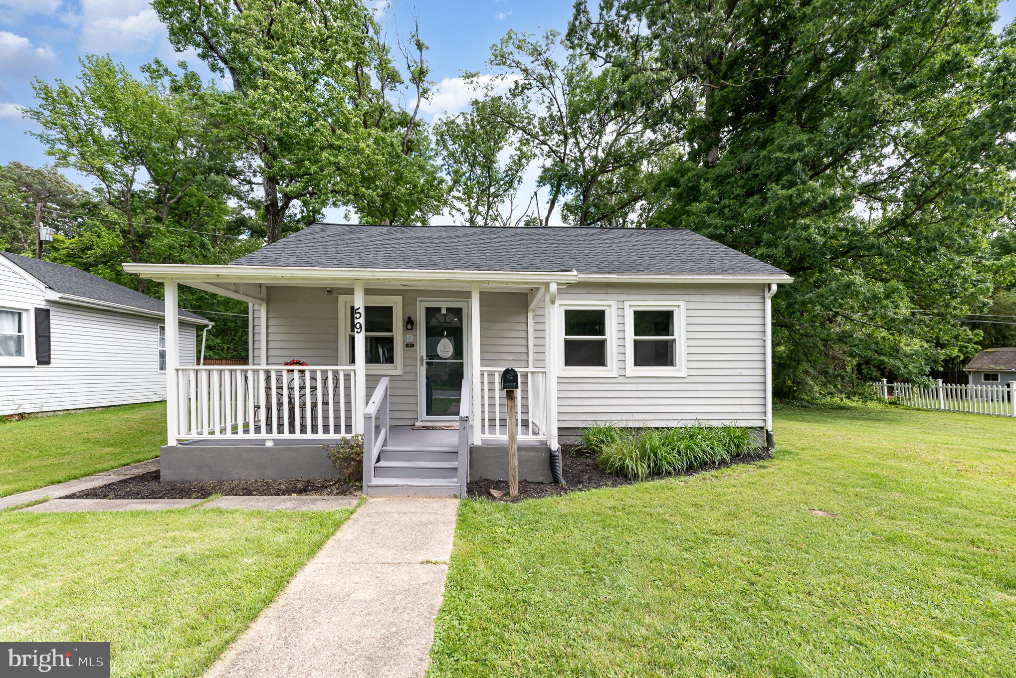 3-bedroom, 1-bath bungalow beautifully renovated in 2021 perfect for those looking for one-level living. The open-concept layout showcases an upgraded kitchen with granite countertops, white cabinetry, modern fixtures, and stainless steel appliances. Brand new flooring in living room, kitchen, and dining area. Enjoy added privacy in the fenced backyard, which backs to a wooded area. A new roof was installed in 2022, and the stone gravel driveway offers convenient parking for you and your guests. Easy and convenient access to I95, 695, and shopping centers. Being sold As-Is.