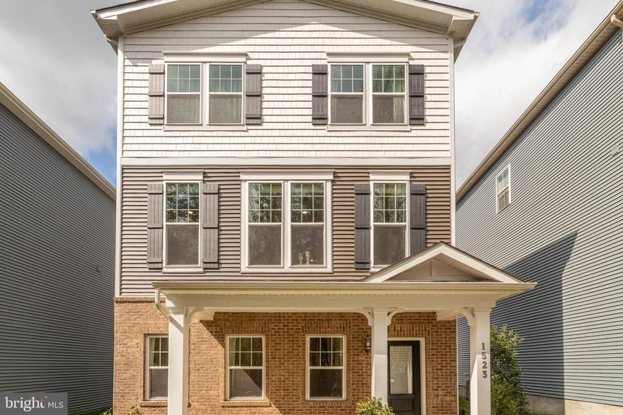 Welcome to this beautiful 3-bedroom home offering a bright and airy open-concept floor plan with stylish finishes and flexible living spaces throughout. Elegant staircases with detailed iron spindles add character and sophistication to the home's design. The stunning kitchen features a large center island with breakfast bar seating, a classic subway tile backsplash, and stainless steel appliances including a gas range—perfect for both everyday living and entertaining.


The adjacent dining area is filled with natural light and offers peaceful wooded views through expansive windows, while the family room features a sliding door leading to the deck for easy indoor-outdoor living. The main level also includes two additional rooms ideal for bedrooms, home offices, or flex space, along with a convenient half bath.


The lower level expands the living space with a large room perfect for a second family room, recreation area, or media room, along with a full bathroom and garage access. Upstairs, you'll find three spacious bedrooms and a full hall bath with a double sink vanity. The impressive owner's suite offers two closets and a private ensuite bathroom with a double sink vanity.


Additional highlights include a 2-car garage and a prime location close to shopping, dining, and Arundel Mills. This home perfectly combines comfort, style, and convenience.