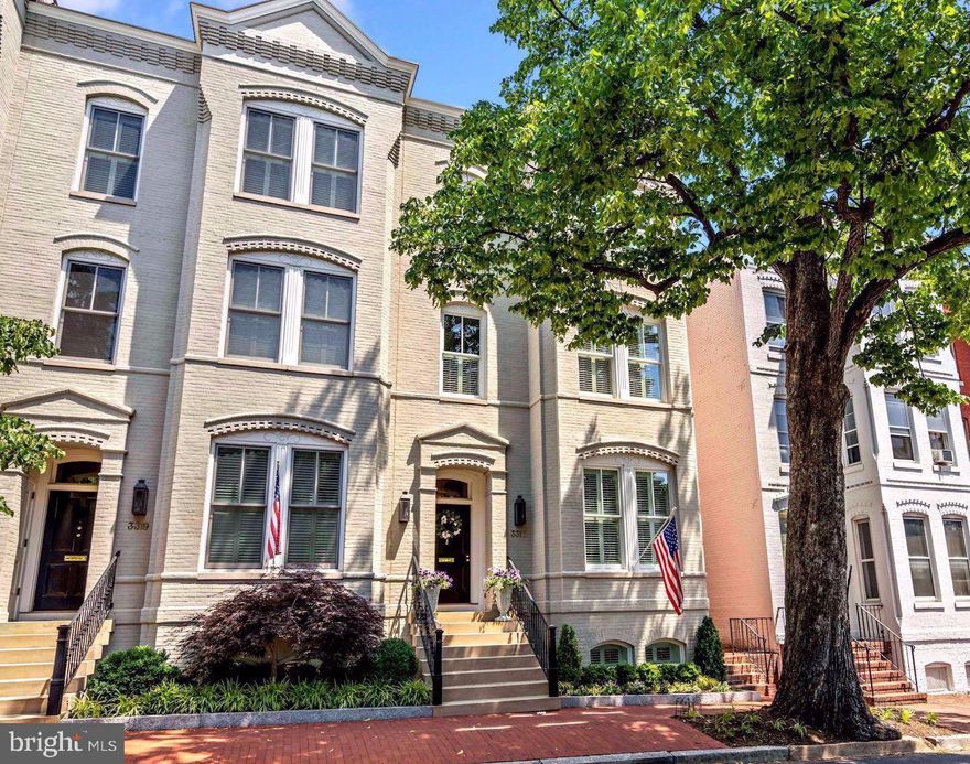 This stunning semi-detached home offers the best of Georgetown living. Built new in 2013 with a modern floor plan and high-end finishes, this property retains the charm of the historic homes with high ceilings, oversized windows and beautiful hardwood floors - all this right in the heart of Georgetown and complete with an ELEVATOR and attached 2 CAR GARAGE. The entire house features spacious rooms flooded with natural light, custom millwork, brand new designer lighting, and custom wide plank hardwood floors. The main level features a formal living room, dining room, and a kitchen perfect for gathering and cooking with a large island and a charming breakfast area. The luxurious primary suite has extraordinary closest space, a spa-like primary bathroom and separate sitting room. The upper level bedrooms each have ensuite bathrooms and the top level makes a great office with skylights and electric shades. The private rear patio is the ideal place to grill and relax outside while surrounded by a thoughtfully landscaped garden. For added convenience, the garage parking is easily accessed directly from the lower level. Floor plans estimate 4,835 total sq. ft.