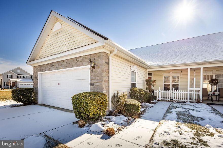 Welcome to this end-of-row townhome showcasing an open floor plan designed for comfortable living. The spacious kitchen features both an island and a peninsula, perfect for cooking and entertaining. A bonus living area has been added to the back, expanding the main living space. Centrally located, the hall bath includes a tub/shower combination and an oversized dual vanity. The primary suite, situated at the rear of the home, offers a walk-in closet and a luxurious bathroom with a walk-in shower, a soaker tub, and a dual vanity. Located in the desirable community of Wood Creek, residents can enjoy access to a pool and clubhouse