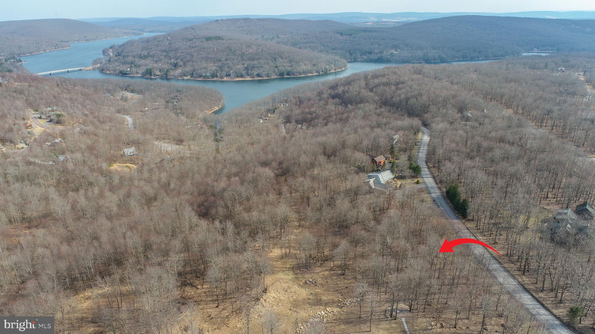 Prime 2-Acre Wooded Lot with Expansive Deep Creek Lake & Mountain Views! Discover the perfect blend of tranquility and adventure with this stunning 2-acre wooded building lot, offering breathtaking panoramic views of Deep Creek Lake and the surrounding mountains. Nestled along a county-maintained road for easy year-round access, this exceptional property provides the ideal setting for your dream home or vacation retreat. Located in the heart of Garrett County’s premier outdoor recreation area, this lot is just minutes from Lodestone Golf Course, ranked among the best mountain courses in the region, and Wisp Resort, offering four-season fun with skiing, snowboarding, mountain biking, and more. Enjoy the peace and privacy of your own wooded escape while being just a short drive from the lake’s marinas, state parks, and charming local shops and restaurants. Whether you're seeking a serene getaway or an investment in one of Deep Creek’s most sought-after locations, this property offers endless possibilities. Don't miss this rare opportunity to own a slice of paradise in the mountains of Western Maryland!