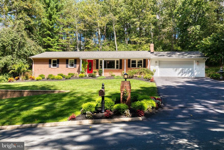 Absolutely gorgeous, updated Crownsville home on a large partially wooded lot with picturesque views, attached oversized garage and a backyard that is a sports lovers dream! From the moment you walk in the front door, you are welcomed with a lovely layout, large windows that flood the house with natural light, fresh neutral paint, and many modern finishes. Stunning kitchen with one year old granite counter tops and high end stainless steel appliances. The main level provides 3 generously sized bedrooms. The owners suite includes two closets and an updated full master bath. The one year new hallway bathroom is updated with new fixtures, a vanity, and LED vanity mirror. The expansive lower level features additional storage space, a full bath, an area for personal gym and plenty of rec room space for activities, movie nights, and more! Lower level provides walk up access to the backyard. The backyard includes a fire pit, large patio with plenty of room for seating and entertaining, professionally installed turf, and regulation half basketball court with hoop! For your convenience, a storage shed is located on the side of the house. Plenty of parking in the attached garage and driveway along with directly in front of the house! The home is tucked away in an established neighborhood close to literally everything! Close to major commuter routes, restaurants, and shops! Check out this beauty today!