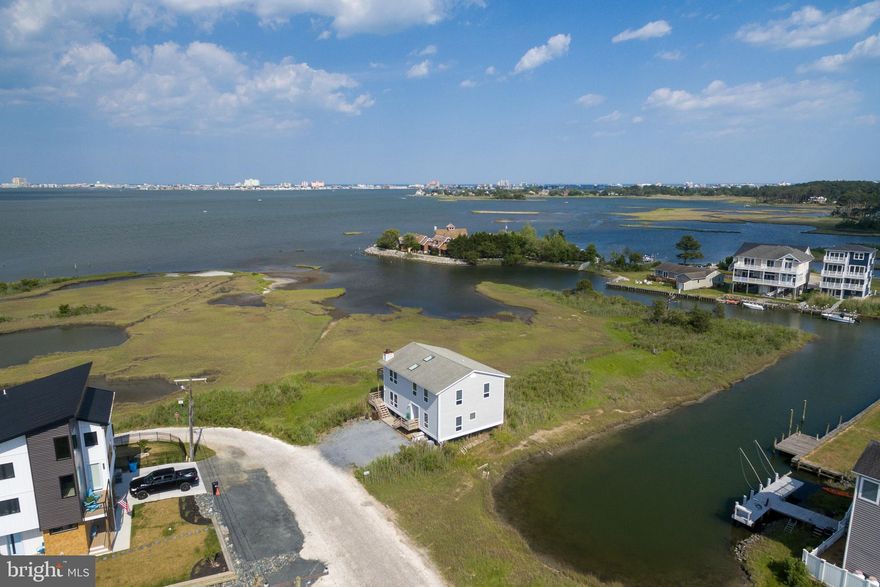 A gorgeous location with a true MILLION-dollar view (Be sure to check out the VIDEO TOUR icon) – This 4-bedroom 3 bath single family home is a must see. This property boasts expansive waterfront views of Ocean City’s entire skyline from North to South. Featuring 2 stories AND 2 wrap around decks to enjoy your private and rare-to-the-area scenic views. This home is uniquely protected from development on all sides, meaning these magnificent Bayfront views will last a lifetime.  The original owner built this home in 1992 for his own private residence. This property has only been used by one family and has never been rented. It offers all modern conveniences such as central air conditioning, heat pumps, all appliances, and updated roofing. This 14,144 Square Foot lot and home conveniently sits at the end of a quiet dead-end road.  This home is situated in a great neighborhood in Cape Isle of Wight West Ocean City, which offers many bonuses as a home owner, such as no city taxes and no HOA fees. Experience the beauty of Ocean City from a tranquil viewpoint, while being only minutes distance from the action. Jump in the car and have your toes in the sand in less than 10 minutes, or better yet, hop in your boat and be in the Atlantic Ocean in 5!  Properties with this much to offer are a true rarity to Ocean City. Contact us today to schedule a private showing of your future beach home!