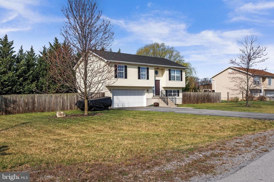 This is the perfect starter home on a corner lot, move in ready and worry FREE!  Recently replaced HVAC.   Hot water heater and roof replaced approximately 2019.  Lower level features a large family room with attached Full bath, and oversized two car garage.  Upstairs Boasts three generous bedrooms, and a large great room for easy and functional entertaining.    Outside you will find a large deck and  spacious yard the rear and sides fully fenced.  Little playground stays.