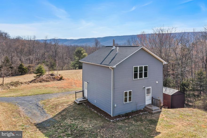 Beautiful Cedar Creek Valley paradise! This 15+ acres includes year round stream frontage, a buffer of mature woods and open grasslands. Not to mention views and privacy.  Built in 2016, this home has all the comforts yet with a minimalist feel.  Lots of windows to enjoy the natural sunlight or starry skies at night,  central HVAC system and wood burning stove for additional heat source, main level bedroom and full bath plus spacious loft area for extra sleeping space or an in-home office!  There's also a full basement with storage area and laundry.  Conveys with storage building and generator!   The land is zoned conservation and the shared driveway traverses the stream.  So many possibilities! - downsize your indoor living for outdoor living, start your own homestead, come for weekend relaxation or  consider the air bnb potential.