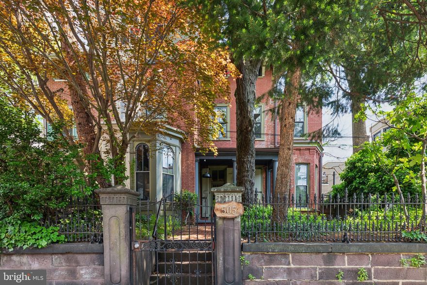 Rare opportunity to own one of Philadelphia's beautifully restored historic homes in the Spring Garden/ Fairmount neighborhood.  505 North 21st Street is a pristine Italianate-style home with 4 bedrooms, a den, a sitting room, 3 ½ baths, and 2 laundry areas and is one of just a handful in the area with 3 private outdoor spaces! This unique home offers a perfect blend of timeless charm, with many original details mixed with modern amenities. The charm begins at the front gate which leads into a private yard complete with a garden, brick pavers, a fig tree, and a front porch with a swing. This beautiful space allows the house privacy while not sitting far off street level.  The double front doors bring you into a lovely foyer and lead you to the next set of original wood doors that enter the main living space.  Upon entering, you are greeted by the grandeur of the home's over 2900 sq ft, providing ample space for comfortable living. The first floor is home to a large living room with a beautifully appointed working fireplace and mantel and multiple windows allowing for ample natural light. The formal dining room is situated next to the breakfast room which features the original stove and a wet bar area. The custom chef's kitchen was fully renovated in 2016 and has beautiful inset cabinetry, a huge pantry, and sliders to the large brick patio with the perfect flow for entertaining and indoor /outdoor dining.  A tucked-away powder room finishes off the first floor.  You can take the elegant main staircase or the convenient back staircase to the second floor.  This floor is home to the primary suite with a private and unique connected sunroom with a cupola ceiling that can be used for so many different purposes!  Next to the primary is a spacious room currently used as a second living room with beautiful south/western light that streams through the 5 ceiling height windows and features another beautiful mantel and custom closets for maximum storage.  The first full bathroom on this floor sits just beyond this room and features beautiful marble details.   On the other side of the 2nd floor is another beautifully designed full bath with a heated floor and a full laundry area including a washer/dryer, laundry sink, and convenient folding station.  There is a tucked-away room with a skylight perfect for an additional bedroom or office space to round out this floor.  The 3rd floor has 2 more sizable bedrooms with built-in closets that share the 3rd full bath with another laundry area including a washer/dryer.  Off this floor is the final outside space, a private roof deck with lovely views, built-in seating, and planters, and is the ideal finishing touch to this gem of a property.  There is a full unfinished basement that allows for tons of additional storage and houses the utilities, including heat and central air that is zoned for each floor.  Situated in a prime location, this home is conveniently walkable to The Art Museum, Whole Foods, Target, Center City, and many restaurants and shops while still providing a serene escape for the new owner.