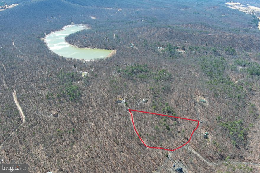 JUST BUY IT AND FIGURE OUT THE REST LATER.....5.6 ACRES OF STUNNING 100% USABLE HARDWOOD FOREST IN THE PRIVATE COMMUNITY OF "LAKE FERNDALE" WHERE OWNERS HAVE ACCESS TO THE 55 ACRE STOCKED LAKE & COMMUNITY BEACH AREA. VERY DESIRABLE LOT WITH MULTIPLE BUILD SITES, A PREMIUM LOT TO SAY THE LEAST, LOCATED IN ONE OF THE NICEST SECTIONS OF THE COMMUNITY. ENDLESS OUTDOOR ACTIVITIES AT YOUR FINGERTIPS: ONLY 1.2 MILES FROM THE LAKE ACCESS......FISH, SWIM, SUNBATHE, PICNIC, ETC.......4 MILES FROM 3 DIFFERENT PUBLIC ACCESS POINTS ON THE SOUTH BRANCH OF THE POTOMAC RIVER....FISH, CANOE, KAYAK OR HOP ON A TUBE WITH YOUR FAVORITE BEVERAGE AND LET YOUR WORRIES FLOAT AWAY.....5 MILES FROM "WHITE HORSE MOUNTAIN WILDLIFE MANAGENT AREA" 1765 ACRES OF PUBLIC HUNTING & HIKING AT YOUR DISPOSAL! PERFECT FOR YOUR FULL TIME HOME, WEEKEND ESCAPE OR BASE CAMP FOR OUTDOOR PURSUITS. IT'LL BE EASY TO "YES" TO THIS LOT....BUY IT NOW AND FIGURE OUT THE REST LATER.....STEP #1 TO LIVING THE DREAM, IS GETTING THE LAND........IF ONLY ALL OF LIFES DECISIONS COULD BE THIS EASY!