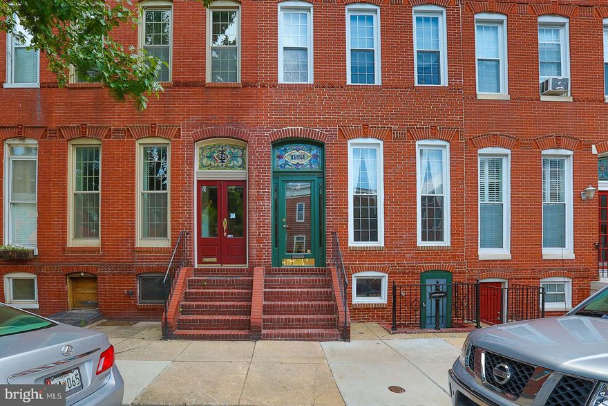 Nestled in the heart of the historic Federal Hill District, this stunning Colonial townhouse exudes charm and modern elegance. Built in 1900, this beautifully maintained residence boasts over 2000+sq. ft. of exquisite living space, featuring four spacious bedrooms and three and a half bathrooms, perfect for both relaxation and entertaining. Step inside to discover a harmonious blend of classic and contemporary design. The interior showcases solid hardwood and luxury vinyl tile flooring, complemented by crown moldings and stained glass accents that add a touch of sophistication. The eat-in kitchen is a culinary delight, equipped with ENERGY STAR appliances, including a built-in microwave, dishwasher, and an extra refrigerator/freezer, ensuring you have everything you need for your culinary adventures. The fully finished basement, complete with walkout stairs, offers additional living space and a large wet/dry bar, ideal for hosting gatherings.  Outside, the property features a detached garage and off-street parking, providing convenience in this vibrant neighborhood. Explore the local amenities, including parks, shops, and restaurants, all within walking distance. Lower level could be in-law apartment! Experience the rich history and community spirit of Federal Hill, where every day feels like a celebration of life. This exceptional property is not just a home; it's a lifestyle waiting for you to embrace. This property has much more to offer. Don’t miss your chance to make it yours. Please contact agent to show. Thank You