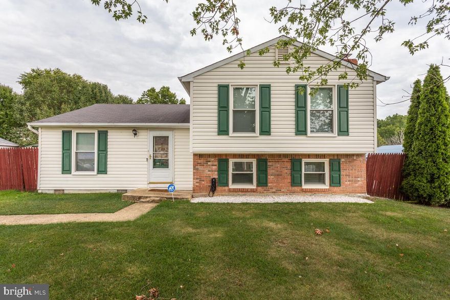 Simply lovely is all I can say.  This charming split-level home features 4 bedrooms, 2 full baths, and lower level area with a huge family room! It has hard wood floors and a separate dining and living room areas .   Their is also an eat-in kitchen with gorgeous brick detail and arched shelving, ceramic tile floor and lots of counter and cabinet space. Master bedroom featuring a ceiling fan and 2 closets, walk-in and reach-in! Additional bedrooms have ceiling fans and generous closet space. Upper level full bathroom has been renovated and even has wired speakers to play your favorite tunes.   Lower level Family Room with Bedroom and Bathroom is perfect guest.   Lower level laundry room offers a full size washer and dryer and storage utility space. Huge backyard with large shed and deck area for outdoor fun all year round! Conveniently located to major highways, shopping, schools, restaurants, DC National Harbor, military sites and more!  Don't miss the opportunity to lease this charming home.