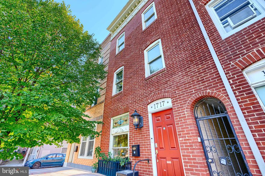 Seller offering $5,000 closing cost assistance + 1-year home warranty with an acceptable offer. Two owner suites. Wet bar. Floating staircase. Whole-house surround sound. 1717 Gough Street is not your average Fells Point rowhome — it is a lifestyle upgrade at an unbeatable price. This stunning 4-bedroom, 3.5-bath brick rowhome spans three finished levels and blends historic charm with high-end modern finishes throughout. The main level welcomes you with gleaming hardwood floors, recessed lighting, and an open floor plan perfect for entertaining. The chef's kitchen impresses with granite countertops, stainless steel appliances, ample cabinetry, and a breakfast bar. Two owner's suites each feature their own private en-suite baths on the 2nd and 3rd floors — ideal for multi-generational living or hosting guests. The entertainment nook with wet bar and wine fridge is a showstopper. The custom floating staircase and accent lighting nooks showcase the craftsmanship found in every corner of this home. Step outside to a private fenced patio ideal for outdoor dining and entertaining. Walk to Patterson Park, Fells Point waterfront, local shops and restaurants, with easy access to Johns Hopkins, I-95, and downtown Baltimore. Immediate possession available. Motivated seller — schedule your showing today.