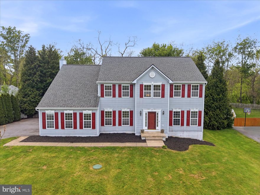 Stunning 5-bedroom, 3.5-bath Colonial tucked away on a private half-acre lot backing to mature trees in the sought-after Willow Springs Acres community of Shepherdstown, WV. Offering spacious living across three finished levels, this home combines timeless style, functional design, and peaceful outdoor living.

Step inside to a dramatic 2-story foyer flanked by a private home office and elegant formal living room that seamlessly flows into the formal dining room—perfect for entertaining. The spacious eat-in kitchen is the heart of the home and features granite countertops, new stainless-steel appliances, a center island with breakfast bar seating, pantry, and sunny dining area. The kitchen opens to the expansive family room highlighted by a cozy wood stove and direct access to the screened-in porch overlooking the tree-lined backyard. A convenient half bath and laundry room complete the main level.

Upstairs, the spacious primary suite offers a large walk-in closet and private en suite bath featuring dual vanities, a soaking tub, and separate shower. The additional bedrooms are all nicely sized, with Bedrooms 3 and 4 connected by a Jack-and-Jill bathroom for added convenience and functionality.

The mostly finished lower level provides exceptional flexibility with a large recreation room, 5th bedroom, full bath, and abundant storage space—ideal for guests, multi-generational living, hobbies, or a home gym.

Additional highlights include a side-entry 2-car garage, oversized driveway with ample parking, open-concept layout, and a serene backyard setting with added privacy. Conveniently located near historic Shepherdstown, commuter routes, dining, shopping, and outdoor recreation.