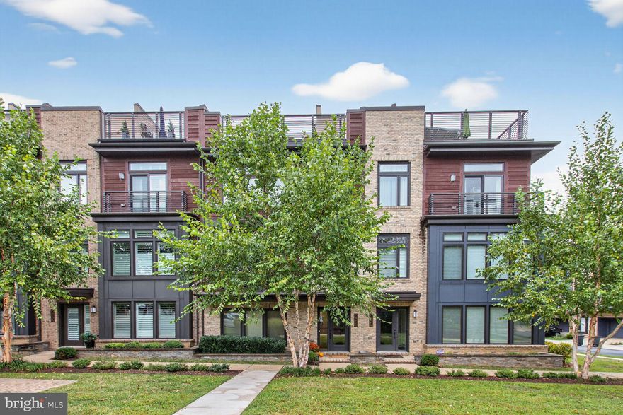 Price Reduced! Join us for an Open House Sunday 4/12. Sophisticated Townhome Living in Grosvenor Heights! Embrace the ease of a true “lock-up-and-leave” lifestyle in this stunning EYA-built elevator townhouse. Beautifully appointed and thoughtfully designed, this home shows exceptionally well. Situated on Barlow Place, one of the community’s most coveted streets, you’ll enjoy a quiet, tucked-away location with great neighbors and views of green space. This four-bedroom, three-and-a-half-bath residence has been meticulously outfitted with top-of-the-line finishes. Elegant iron railings, custom kitchen cabinetry, and quartz countertops set the tone for a home that is both stylish and functional. The chef’s kitchen is a true showpiece, featuring a five-burner gas cooktop, wall oven, built-in microwave, counter-depth refrigerator with custom panels, and a massive quartz island. Additional counter seating provides space for up to eight people. Both the living room and dining room showcase floor-to-ceiling windows with access to outdoor decks, while a gas fireplace and designer lighting enhance the ambiance. Upstairs offers a warm and inviting primary suite with custom-designed dual closets and a spa-inspired bath, along with two additional bedrooms, a full bath with an upgraded soaking tub, and a conveniently located laundry room. On the entry level, a versatile flex room with a private full bath can serve as a guest suite, home office, fitness studio, or second family room. A Control4 Smart Home System places lighting, sound, TV, and security right at your fingertips. The rooftop terrace is a private retreat, fully equipped with every upgrade: built-in gas grill, dishwasher, mini-fridge, prep space, retractable awning, gas fireplace, and wood-look tile flooring. Designed for both entertaining and relaxation, it’s perfect for al fresco dining, game-day gatherings, or simply enjoying the sunset. The rear-entry garage accommodates two cars and offers direct elevator access—making it effortless to load luggage, groceries, or packages without ever climbing a step. A mudroom with a large storage closet connects the garage to the home for added convenience. Set within Grosvenor Heights, the location offers the perfect balance of tranquility and connectivity. Stroll the lush walking paths of Fleming Park, the Bethesda Trolley Trail, and Rock Creek Trail, or take advantage of nearby access to the Metro, major highways, Wildwood Shopping Center, Pike & Rose, and the Music Center at Strathmore.