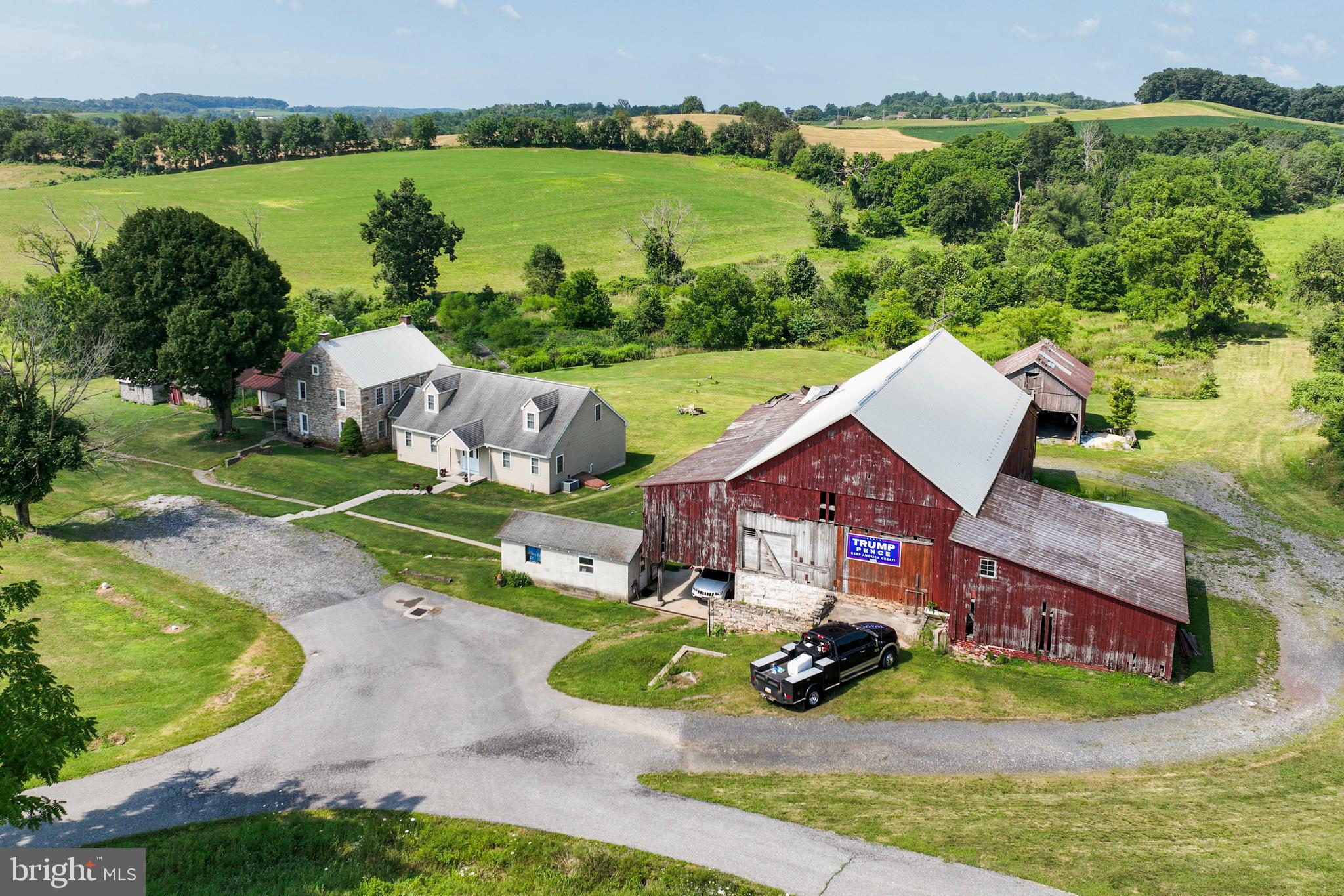 73+ acres with Old 1700's Stone farmhouse, Original Large Bank Barn needs TLC and various Outbuildings. On the 2nd floor there are 3 Bedrooms, with unfinished full bathroom. First floor kitchen and living room, full bath w/laundry. A summer kitchen and root cellar are attached to the farmhouse. Make your way through the breezeway to the attached Cape Cod addition. 3 Bedrooms with full bathrooms attached to each room Two of the bedrooms/bathrooms are on the 2nd floor. First floor offers a Master Bedroom and Bathroom with walk in closet. There is a 1/2 bath on first floor w/laundry room. Farmland Preservation Clean & Green. Approx. 35-40 tillable acres. Stream runs through property. Across the street from Saint Mary Church, close to Blue Mountain Academy, Cabela's and Hamburg. Farm includes a total of 30 lots. Also see MLS: PABK2019230; 27 lot subdivision available for sale $899,900. Ready to build.