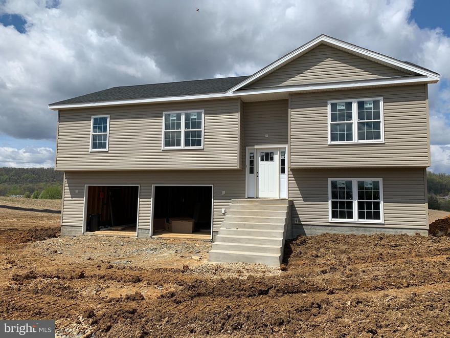 UNDER CONSTRUCTION ON PREMIUM LOT [$10,000 LOT PREMIUM INCLUDED IN PRICE] WITH FARM AND MOUNTAIN VIEWS ANTICIPATED COMPLETION LATE MID TO LATE JUNE.     [PLEASE NOTE THAT THESE PHOTOS ARE OF SIMILAR CONSTRUCTION]     THIS SPACIOUS SPLIT FOYER DESIGN OFFERS 2,100 sq. ft. OF FINISHED LIVING AREA AND FEATURES A SPLIT BEDROOM DESIGN WITH A GREAT ROOM FEATURING CATHEDRAL CEILING SEPARATING THE MASTER SUITE FROM BEDROOMS #2 & 3. THE EAT IN KITCHEN HAS UPGRADED CABINETRY, GRANITE COUNTERS, STAINLESS STEEL APPLIANCES, GARBAGE DISPOSAL AND AN ISLAND WITH OVERHANG FOR STOOLS. THE SPACIOUS MASTER SUITE FEATURES HIS AND HERS WALK IN CLOSETS, TRAY CEILING & CEILING FAN AS WELL AS A MASTER BATH WITH A DEEP SOAKING TUB & A SEPARATE OVERSIZED SHOWER, DOUBLE SINK VANITY, PRIVATE WATER CLOSET AND LINEN CLOSET. THE TREMENDOUS, OVERSIZED FINISHED TWO CAR GARAGE HAS  TWO AUTOMATIC GARAGE DOOR OPENERS AND PLENTY OF SPACE FOR ADDITIONAL STORAGE SHELVING / WORKBENCHES, ETC WHILE STILL ALLOWING PLENTY OF SPACE TO PARK TWO CARS.  THE FINISHED LOWER LEVEL FEATURES A SECOND MASTER SUITE / FAMILY ROOM WITH A THIRD FULL BATHROOM AND WALK IN CLOSET. ALL OF THIS LOCATED IN AN UPSCALE DEVELOPMENT WITH SIDEWALKS, CURB & GUTTER, CONCRETE DRIVEWAYS AND INDIVIDUAL SIDEWALKS. CALL TODAY TO ARRANGE TO VIEW THIS HOME. PLEASE NOTE THAT PHOTOS ARE OF SIMILAR CONSTRUCTION. ADDITIONAL BUILDING LOTS AND FLOOR PLANS TO CHOOSE FROM...