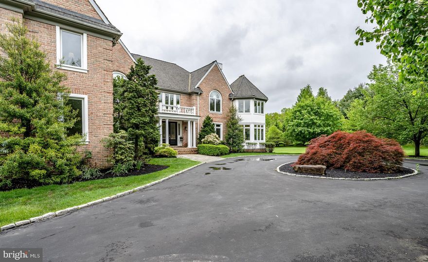 This magnificent estate home, in the heart of the Main Line, is situated on 2+ beautifully landscaped acres with fruit trees and a fully functioning green house. With an array of luxurious amenities, this home's open and airy interior is filled with expansive spaces, high ceilings, wood floors and an abundance of windows, bringing in natural light. With its statuesque brick front, accented with columns and a balcony, this home opens with a dramatic center hall foyer with a sweeping turned staircase. The foyer is flanked by the formal living room with gas fireplace and formal dining room. Off of the living room is a solarium, perfect for a music room. A beautifully styled granite-topped center island sets the focus in the expansive kitchen. In rich wood tones, the kitchen is filled with granite countertops, an industrial range, subzero refrigerator, additional subzero fridge drawers, trash compactor and double dishwasher, all with cabinetry fronts. Off of the kitchen is a theater-styled, two-story family room embellished with wainscoting, exposed beams, floor-to-ceiling windows, and a raised gas fireplace. A butler's pantry is located off of the kitchen and dining room. A half bath and laundry room are conveniently located near the kitchen and family room areas. On the other side of the home's main level is a cozy library with custom built-in shelves for a book collection or other collectibles, as well as another gas fireplace. The custom plantation shutters complete the library. An extensive wrap-around deck allows easy access to the beautiful grounds from just about any room on the main level. The upper level presents a sumptuous master bedroom suite with his and her bath area and double walk-in closets. The master bedroom features a 2nd solarium, perfect for lounging. Four addition bedrooms complete this level, each with a private bath and walk-in closet. The finished lower level, filled with natural light, features a pool table/gaming area, theater room, exercise space and recreation room. This estate home has so much to offer and provides easy access to all the Main Line attractions, restaurants, country clubs, schools and shopping, coupled with an easy commute time to Philadelphia and Wilmington! You will be proud to claim ownership of this extraordinary estate home!