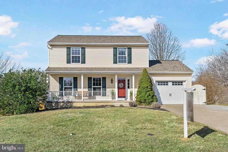 Rarely available in Eldersburg Estates is this beautiful and meticulously well kept porch front home on a corner lot with 1 car garage and classic modern amenities throughout! Enjoy gleaming hardwood floors on the main level, recessed lighting, crown molding, large living room, bright dining room, spacious gourmet eat-in kitchen with stainless steel appliances, granite countertops, double gas oven and 5 burner stove, and powder room.  Upstairs is the Primary Owner's Suite with a large closet and ensuite bathroom with tiled shower, and three more spacious bedrooms, and a full bathroom with tub and shower.  On the lower level is a large updated family and recreation room with new flooring and paint, and a laundry room with a 3 year old washer and dryer. The fenced-in backyard is great outdoor space for entertaining year round with a deck for grilling, an extensive brick patio with fire pit, stone table and bench, and a She Shed/Man Cave with barn door, a built-in bar, large bench for all your guests, laminate flooring, electricity, Wifi, beamed ceiling, and a raised wrap around deck. Both the house roof and the shed roof were replaced in 2019. The community has 2 playgrounds and 2 tennis courts and is close to nearby parks, shopping and dining.  Schedule your tour today!