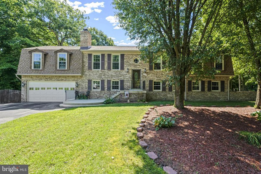 Welcome to this meticulously maintained almost 3000 sq ft, 3 bd, 3 bath home in the sought after Clarks Run community!!! Make your way to the front door soaking in the desirable curb appeal with landscaping, steps leading to your front porch, 2-car garage and extended brick half wall boarding the front yard exterior.  This home features freshly painted walls, new luxury laminate plank flooring, 2 wood-burning fireplaces, stunning kitchen with granite countertops, SS appliances & bay window overlooking backyard, and spacious family room with doors leading to outside 3-TIER DECK overlooking your own private backyard oasis! A dream deck and backyard for entertaining!!! Backyard boasts inground pool with a flat, level & usable HUGE yard backing to woods! Bring the party to the lower level which includes a second family room, rec room, dry bar, full bathroom, and laundry.  Doors off second family room bring you to a large a screened in back porch with a second dry bar... screened in porch also connects you to pool patio... perfect setting for summer BBQ's! Run don't walk... this one won't last long!!!