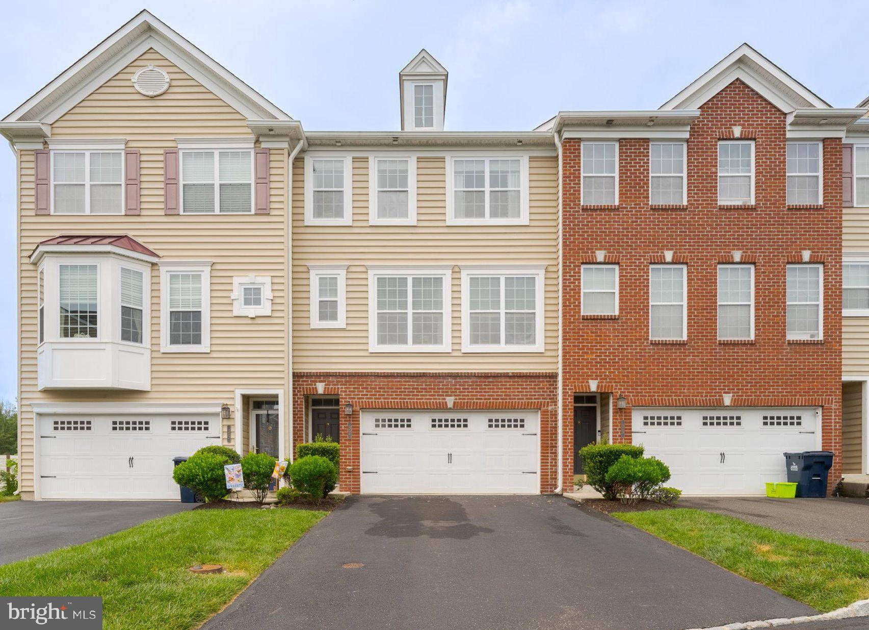 Welcome to 37 Rosy Ridge. A 3 bedroom, 2.5 bathroom townhome in the stunning Country View Estates. This one is move-in ready! The entire home presents as a cohesive space, with handsome wood or LVP floors, small areas of freshly shampooed carpets, neutral paint tones, overhead lighting, ceiling fans, and so much more! You can enter the home through the front door into a small foyer or through the spacious two-car garage into the lower level living space. This charming area offers built-in shelving, propane fireplace, and slider access to your expanded stamped concrete patio. Not to be overlooked, this house comes with a brand new HVAC system! Heater, A/C, & Hot Water Heater were all replaced in May 2024. The main floor of the home has an expansive great room. Perfect for the open concept buyer. Ample space to divvy up to best fit your lifestyle. Adjacent to the great room you'll find a beautiful eat-in kitchen complete with dark wood cabinets, island, stainless appliances (newer refrigerator ('22) and dishwasher ('23)), popular light fixtures, built-in microwave, and pantry cabinet. A glass sliding door provides access to your second outdoor space; an extended deck with privacy barriers. Finishing the first floor is a bright & tasteful powder room. Upstairs the primary suite offers a large bedroom with an impressive walk-in closet, and a primary bath boasting a double sink plus central vanity and subway tiled standing shower with bench. The second bedroom enjoys a double closet and ceiling fan, while the third bedroom has overhead lighting and crown moulding. The full hall bathroom is neutral in tone, with a linen closet for storage, and its shower tub and simple surround allow for low maintenance cleaning. The brand new (March 2025) laundry room with its tile floor, shiplap wall, storage cabinets, and newer (2022) washer and dryer means no carrying heavy laundry up and down stairs! Souderton Area SD and easy access to major commuting veins. The only thing this home needs is a new owner!