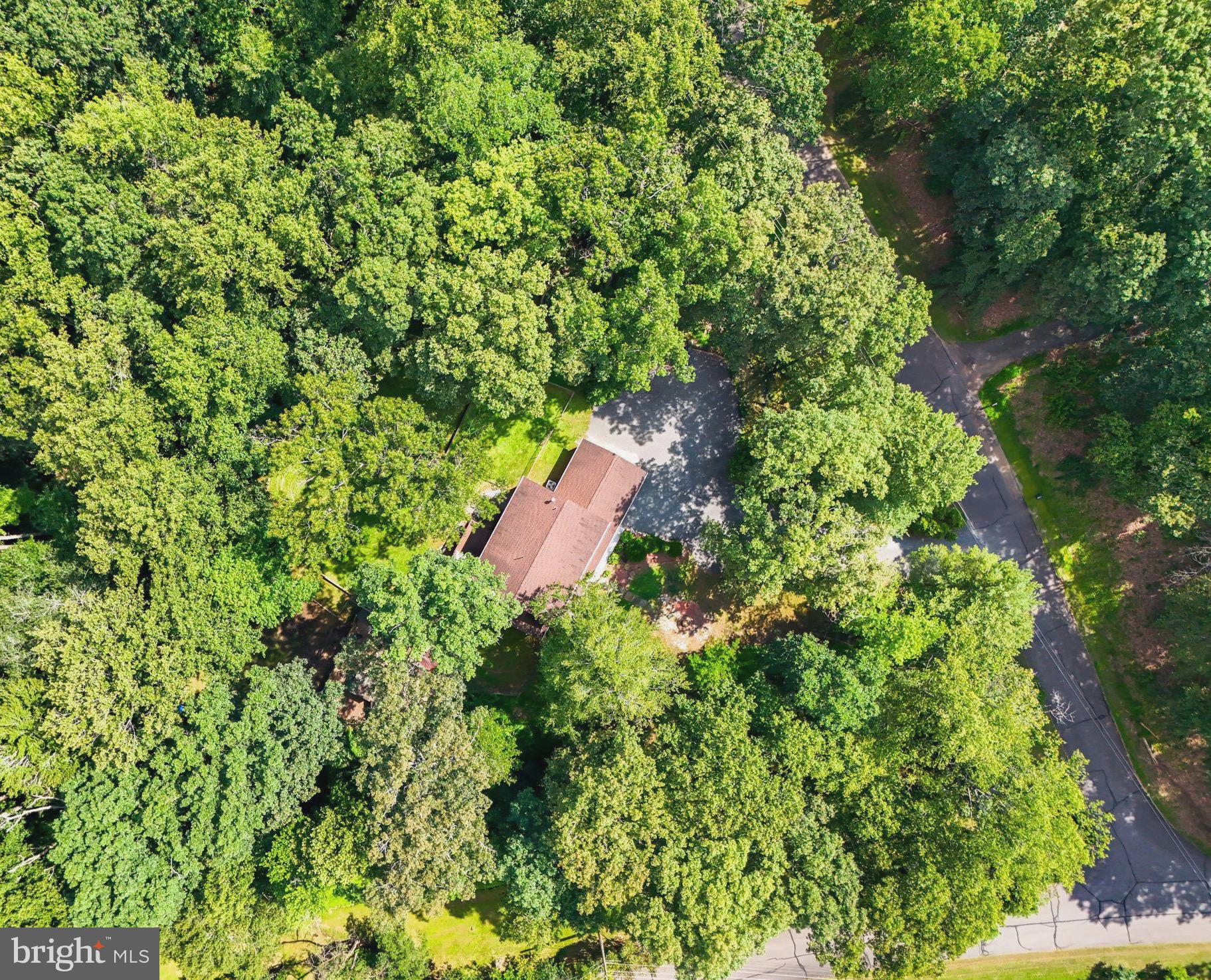 Dreaming of country living without sacrificing urban convenience? Welcome to 11109 Ravine Drive—a unique lifestyle property offering space, serenity, and a true connection to nature, all within commuting distance to Washington, D.C. Perfectly situated in the highly desirable Raintree Subdivision, this beautiful home sits on 3 acres of privacy, purpose, and potential. Zoned A-1, it's ideal for a micro farm, private family compound, or anyone seeking room to grow and explore.
This home is approved for a VA assumable loan at an incredible 2.5% interest rate, presenting an exceptional financial opportunity for eligible buyers. The property has been transformed into a park-like retreat, previously used for outdoor education and wellness, and now thoughtfully enhanced with features including a custom-built treehouse, archery range, pergola, and a fully functional chicken coop for fresh eggs and sustainable living. A long, tree-lined driveway offers a grand and private entrance, with ample space to add a pool or expand.
Inside, the home is filled with warmth and functionality. The bright, sun-filled living room features a newly upgraded wood-burning fireplace and a well-maintained chimney. The spacious kitchen opens to a large rear deck overlooking serene, wooded views, while the formal dining room connects to a screened-in porch for year-round enjoyment. A main-level home office or flex space adds versatility.
Upstairs offers four generously sized bedrooms, including a renovated primary suite with custom closets and a spa-like ensuite bathroom. A full hallway bath and an expanded laundry room with added square footage complete the upper level.
The fully finished walkout basement includes a newly added full bathroom, a bonus guest room, and an expansive recreation area perfect for a home gym, media room, or multi-generational living.
Notable updates include all new windows in 2019, a new garage door in 2023, a roof replacement in 2017, water treatment system added in 2020, screened gutters installed in 2020, and a custom chicken coop built in 2019.
Located just a short drive from D.C., this property offers easy access to the VRE train, Quantico Marine Corps Base, Fort Belvoir, George Mason University, and Manassas Regional Airport. If you're searching for a country retreat with modern comforts and unbeatable access to Northern Virginia's top destinations