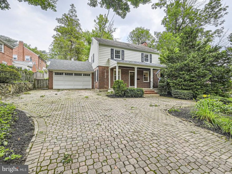 A charming 3BR/2.5BA colonial located in the desirable neighborhood of West Towson available for rent! A large paver stone driveway brings you to a beautifully landscaped front yard with flowering plants, green lawns, and adult trees.  A covered front porch leads to the front door of this classic home filled with tons of original character.  Step inside to a newly painted interior with crown moldings and gorgeous hardwood flooring on the main and second floors. The spacious living room has tons of natural light with a wood burning brick fireplace centering the room.  A hallway with a half bath featuring a pocket door is on the way to the amazing kitchen.  The open concept dining room and kitchen are ideal for hosting family and friends. The stunning kitchen offers tons of cabinets, stainless steel appliances including a vented range hood, quartz countertops with a complementing backsplash, and a peninsula between the rooms with a large stainless sink and pendant lighting.  Onto the second floor with a spacious foyer outside of three bedrooms, beginning with a large primary offering his/her closets, a spacious secondary, roomy third bedroom, and a classic black and white tiled designed full bath.  The lower level offers additional living space ideal for a family room with space for an office, a newly remodeled full bath with a walk-in shower, laundry, and storage.  A two car garage can be accessed from the kitchen. Step out the kitchen door onto a paver stone patio under a pergola with a sun shade surrounded by blooming gardens, green lawns, shade trees, and a fenced yard. Conveniently located to Towson University, area hospitals (St Joe's and GBMC), and shopping/dining in downtown Towson!