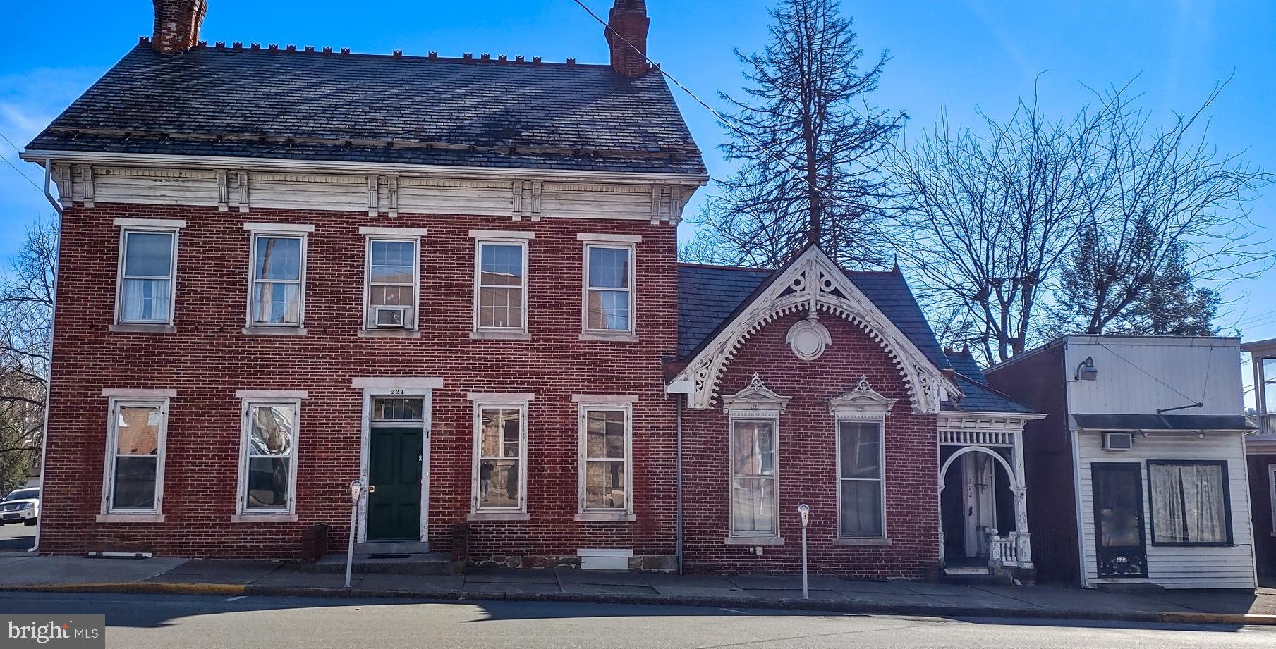 This multi-family property with 5 residential units and a commercial space offers an incredible opportunity for investors. 3 of the residential units are currently rented, so you can start generating rental income right away. This property is perfect for an investor or owner-occupant who wants to have rental income while living on the premises.
This historic home features several original details. There are three 1-bedroom units and two 2-bedroom units.
The commercial space is versatile enough to be used as a retail boutique, office, or even studio space so you can expand your portfolio while enjoying additional revenue streams from rent. This unique property provides plenty of charm and character with its historic features - making it attractive to both renters and business owners alike. Don't miss this once in a lifetime chance to own a great piece of real estate with endless possibilities!