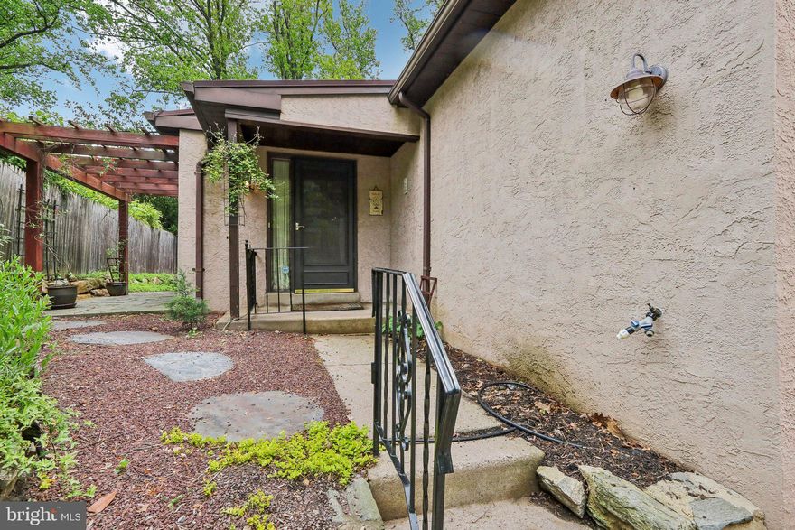 PRICE REDUCED - A unique 3 bedroom top of the hill twin set back from Rex Ave and accessible via a shared driveway is available for just the 2nd time in 20 years.  With two bedrooms on the main floor, this private, low-maintenance home is ideal for one-floor living.  Multiple skylights provide abundant natural light and a desirable warmth throughout the main floor.  The third bedroom, a family room, and a large, versatile open space are found downstairs. Newer electric utilities located on the lower level have been carefully maintained with service performed annually.  In 2011 the walls were removed from the kitchen and a new countertop and cabinets were installed, opening the living room and dining room to even more light.   Outside the front entrance surrounding the driveway is a curated garden with plantings that flourish and bloom throughout the growing seasons.  A private side patio with pergola and access to the living room by sliding doors offers ideal space for quiet reflection.  Just steps away is an informal patio at the front of the house.  A mere five-minute walk to the "top of the hill"  leads to what Chestnut Hill offers: unique shops, inspired dining, and public transportation to downtown Philadelphia and beyond.