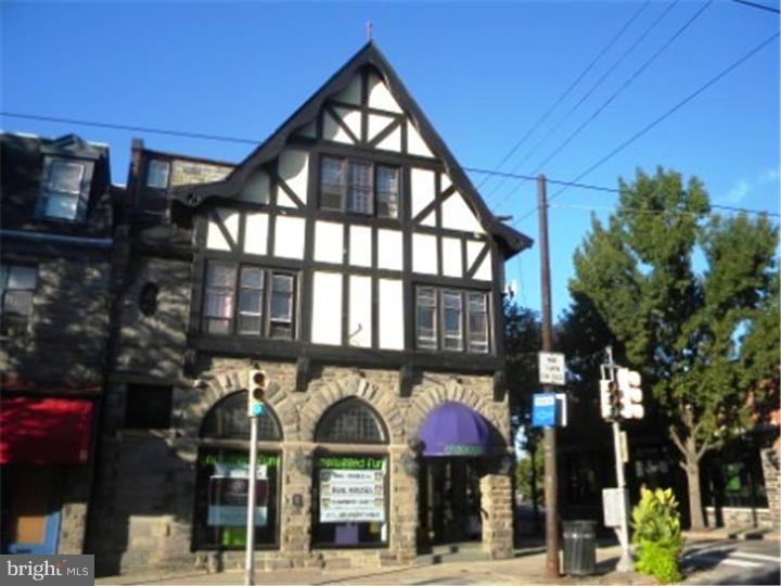 For over 120 years this three Story Jacobean-Tudor Revival Building has only been owned by two families but home to many a thriving business and residential tenant. Henry Houston's vision that this building be placed at such a prominent point within the commercial district was to make a statement of permanence and success. Designed by Architect George T. Pearson who (Bldgs at Phila Cricket Club). Built in 1892 and became home to the Streepers and their Apothecary. The exterior of the building consists of locally ored Wissahickon Schist and Tudor Style half timbering on the upper levels The roof is gabled with slate shingles. The first floor is 2100 sq ft of dynamic retail. The arched windows are a retailers dream. Bathroom is ADA approved. First floor includes large closet and office area. Two full basements allow for storage or additional office space. The basement storage area can be accessed from Evergreen for easy deliveries. Also a three car detached garage in the rear off Evergreen. The first floor apartment has separate entrance on Evergreen. As you enter the hardwood foyer with an additional foyer sitting area on upper level that features a faux fireplace and exterior covered porch. The apartment has hardwood floors as well throughout the bedroom, living room, and dining room. Both the living room and dining room are accented with Large Bay windows. The large eat in kitchen is complemented by a generous pantry storage area, as well as, tucked away laundry area. The full shower over tub bath is decorated with ornate wainscot and ceramic tile floor. The third level apartment flooring is painted pine throughout the large foyer area, living room and bedroom. There is also a full shower over tub bath and bright and cheery kitchen. There is a large attic for storage or could be converted into additional living space. Units are separately metered for gas and electric. The first floor prime retail space is immediately available and the upper levels leases are up soon. As the new owner of this one of a kind building you could open your dream business on the best corner in Chestnut Hill & collect rents from your residential tenants on the upper two levels or convert the upstairs to your new townhome on the Avenue - as it was originally built back in 1892. As the new owner of the unique building you could make both history and income.