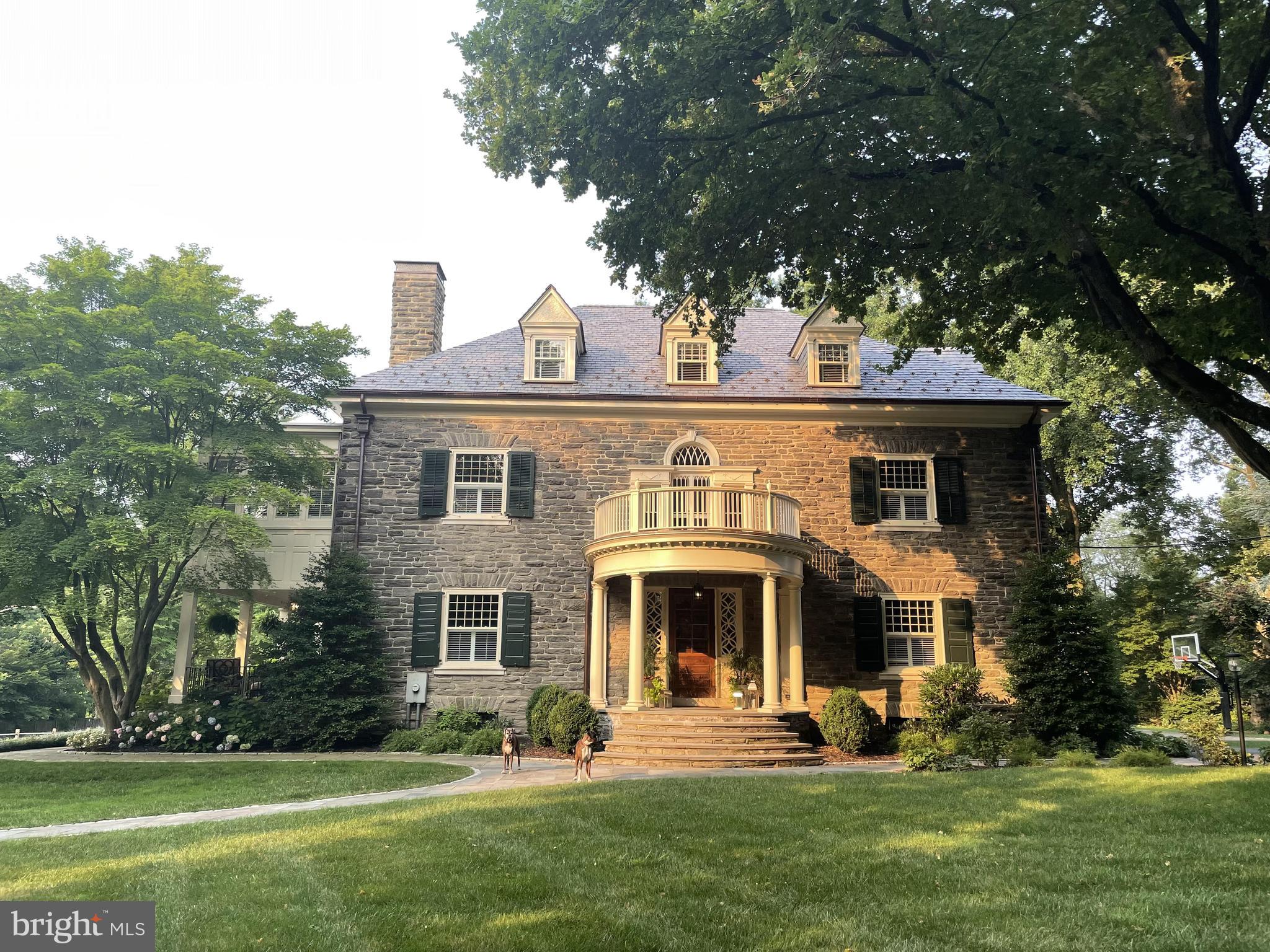This exceptional residence sits on one of Chestnut Hill's most coveted streets. 8204 Seminole is an architectural gem, designed by the prestigious architecture firm of Hazzlehurst & Huckle at the turn of the century. Sweeping lawns, beautiful mature trees, a separate carriage house and a three car garage make this an exceptional property.
Over the past ten years, this prominent residence has experienced renovations and meticulous restorations to amplify its original character and beauty. Old world elegance and craftsmanship include 10 foot plus ceilings on the first and second floors, elaborate millwork, beautiful original doors and windows with energy efficiency updates, wood burning and gas fireplaces and timeless fixtures throughout.
This home seamlessly blends a grand entrance hall and formal dining and living rooms with a more casual kitchen and family room space designed for modern living. The adjoining living rooms have French doors that access a covered porch and steps to a bluestone patio, perfect for enjoying a summer evening. The new kitchen features coffered ceilings, custom cabinetry and quartzite countertops highlighting a Lacanche Sully 1800 range which is a combination of gas, French cooktop and induction as well as gas and electric ovens. It truly is a chef’s dream!
The new 1,000 square foot master suite includes a master bedroom, dressing room, luxurious bath and wet bar. The master bedroom has a corner gas fireplace and access to both the bathroom and dressing room. The dressing room features ample custom cabinetry for his and her closets as well as a cozy sitting area. The master bath has a large soaking tub and his and her vanities. Three of the remaining six bedrooms are en suite. All bathrooms and powder rooms have been renovated.
The house has central air, a new smart home security system and updated electrical wiring throughout. The brand new Vermont slate roofs on both the main house and the carriage house are of upgraded thickness to one half of an inch and includes new copper chimney caps, copper flashings, pure bronze snow guards, heavy duty copper half rounds and copper gutter guards. The decorative collection boxes on the top two corners of the front of the house have been restored and attached to the new copper downspouts. The front portico deck and railing were restored to their original 1892 design using historical archives obtained from the Chestnut Hill Conservancy.
Adjacent to the working garden is an impeccably maintained two story carriage house that boasts two bedrooms, one and a half baths, full kitchen, family room and private yard.
Enjoy all that Chestnut Hill has to offer in this centrally located home. Walk to all the highlights and conveniences of the neighborhood including shops and restaurants, schools, local train lines to Center City and the many trails of Fairmount Park.
