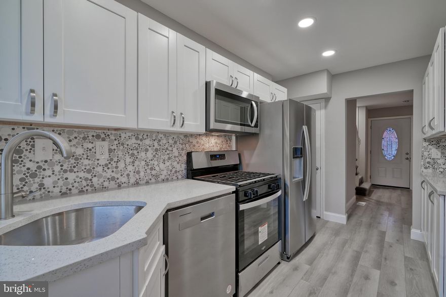 Completely Renovated Home, so Elegant ! All new Kitchen with Stainless Appliances, Quartz Countertops, Coordinating Tile Backsplash, Wood Shaker Cabinets. Extra cabinets and Counter Space, Upstairs Bathroom features Custom Tilework, Designer Fixtures, and Designer Lighting. Basement Suite includes Family Room, Bedroom and Private Full Bathroom with Custom Tilework and Designer Fixtures. New Flooring and Carpet, New Deck, Fenced Backyard, New HVAC, Front Porch, Cool Lighting. Master bedroom has 2 Closets, You will Love this Home!