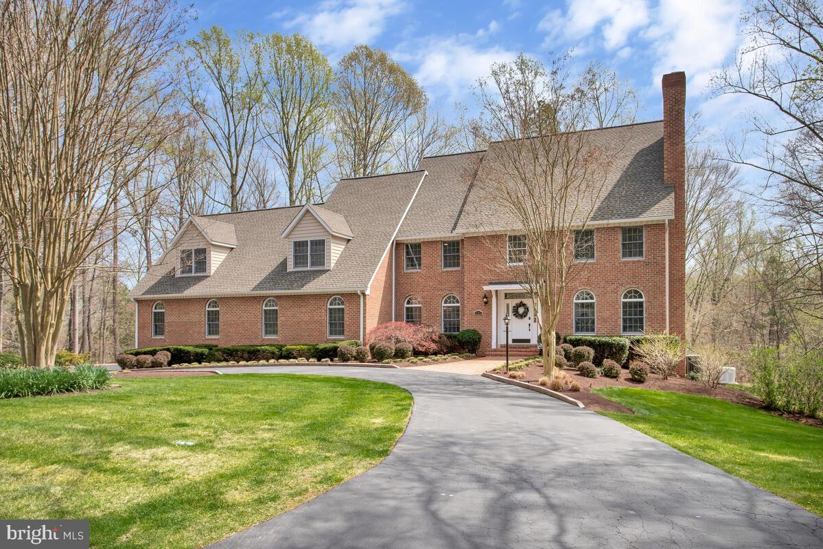 Gorgeous Custom Built Estate!! This 6 bedroom/4 full bath /2-1/2 baths all brick home is a must see! Home has 2 primary suites-one located on the main level, and the other on the upper level, both with stylishly updated baths. Main level has gleaming hardwood floors, private office, and tons of natural light. Lower level has a custom wood full bar and large rec area for plenty of entertaining. There are many upgraded features including 4-Zone Trane HVAC systems, whole house GENERAC generator, Anderson windows, 3 wood burning fireplaces, circle driveway, and huge 3 car garage with built in cabinets for storage! Roof and gutters have been replaced in the last 3 years, and the expansive composite and vinyl deck is essentially maintenance free! All situated on a private lot that has been professionally landscaped and includes an irrigation system.