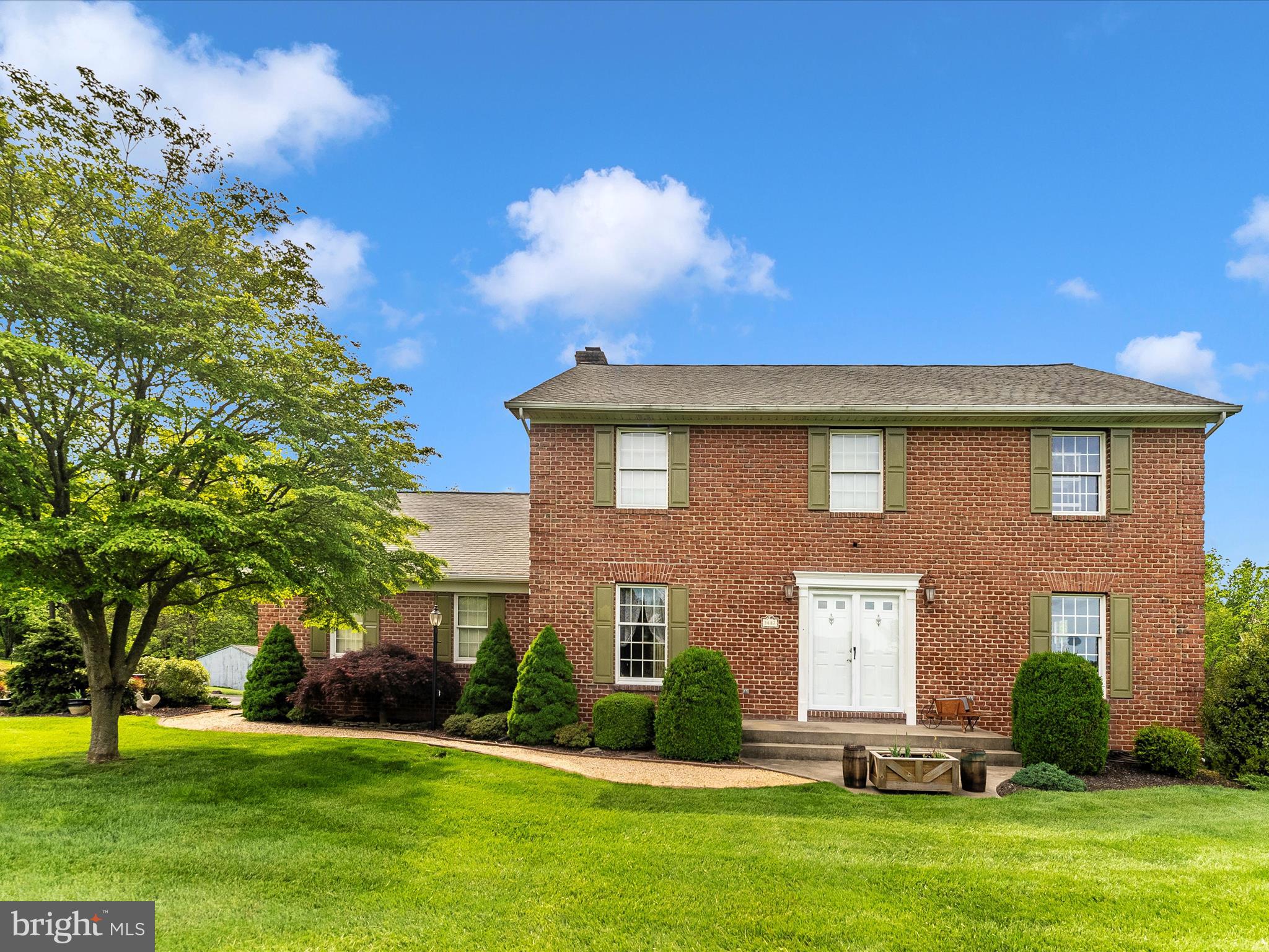 Pride of ownership radiates from every inch of this beautifully maintained home, ideally situated on a rare, 3-acre lot in a setting you’ll be proud to call home. 3887 Saint Clair Court is surrounded by uniquely stunning properties and offers postcard-worthy views—rolling hills and a neighboring pond out front, peaceful woods in the back.
Step inside through the mudroom entry off the oversized garage or the striking dual front doors and enjoy a classic, functional layout. The main level features a centrally located eat-in kitchen with oversized windows, granite and butcher block-style countertops, and custom oak Lippert cabinetry. You'll also find formal dining and living rooms, a private office, a half bath, laundry/mudroom, and a spacious family room with a cozy wood-burning brick fireplace. Two access points lead out to a generous deck overlooking a manicured lawn, landscaped paths, and wooded serenity.
Upstairs offers three spacious bedrooms with oversized closets, two pristine bathrooms, and an en-suite office space that could easily be converted into a fourth bedroom with pre-planned access from the main hallway. The walkout basement adds even more value with soaring 10-foot ceilings, a bar area, and built-in surround sound—ideal for entertaining or relaxing at home.
You will want to spend a lot of time outside at this home! With plenty of room to add a play set, a pool, and/or covenant free land use options for potential livestock, the opportunities are endless at 3887 Saint Clair Court.