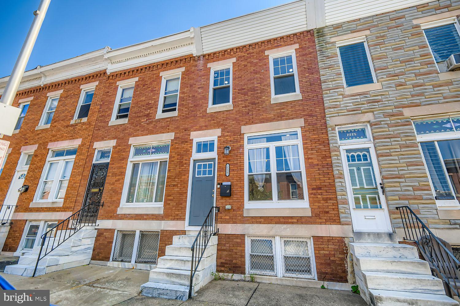 Full Gut Renovation in 2023!  Welcome to this beautifully updated rowhome that perfectly blends historic charm with modern amenities. Step inside to find rich gunstock hardwood floors, exposed brick accents, and recessed lighting throughout. The spacious dining room easily hosts family gatherings, while the chef’s kitchen is a showstopper with soft-close wood cabinetry, granite countertops, stainless steel appliances, a stylish backsplash, and bonus pantry storage. A full main-level bathroom adds rare convenience for guests or roommates. Upstairs you’ll find three generous bedrooms, each with large closets—including a walk-in that serves as the owner’s game room. The primary suite is bright and inviting, while the stylish full bath features elegant marble tile that extends seamlessly behind the vanity and toilet. The finished basement has been rented for $950/month, offering excellent house-hacking or income potential. Outside, enjoy a concrete BBQ patio and fenced grassy yard—perfect for pets and entertaining. Additional highlights include a beautiful hardwood staircase, a spacious and versatile floor plan, and a desirable quiet block in the up-and-coming East Baltimore Midway neighborhood, just steps from parks, restaurants, and local shops. Owner loves the home but must sell due to life circumstances and is looking to sell quickly with some flexibility for the right buyer. Love it or leave it! Our 12-month Buy it Back or Sell it for Free Guarantee gives you peace of mind. Have a home to sell? Buy this home, and we’ll buy yours for cash!* Part of our Everyday Open Program. Schedule a tour today!