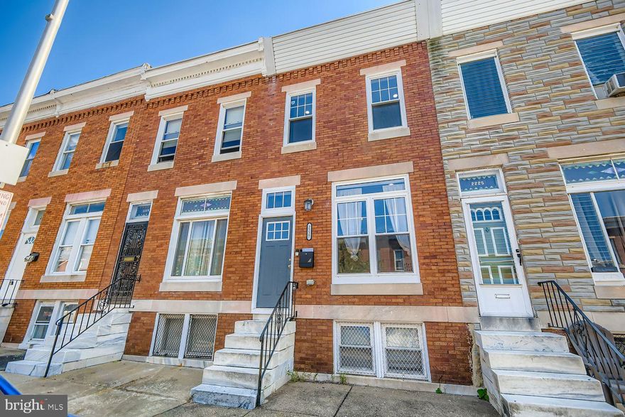 Full Gut Renovation in 2023!  Welcome to this beautifully updated rowhome that perfectly blends historic charm with modern amenities. Step inside to find rich gunstock hardwood floors, exposed brick accents, and recessed lighting throughout. The spacious dining room easily hosts family gatherings, while the chef’s kitchen is a showstopper with soft-close wood cabinetry, granite countertops, stainless steel appliances, a stylish backsplash, and bonus pantry storage. A full main-level bathroom adds rare convenience for guests or roommates. Upstairs you’ll find three generous bedrooms, each with large closets—including a walk-in that serves as the owner’s game room. The primary suite is bright and inviting, while the stylish full bath features elegant marble tile that extends seamlessly behind the vanity and toilet. The finished basement has been rented for $950/month, offering excellent house-hacking or income potential. Outside, enjoy a concrete BBQ patio and fenced grassy yard—perfect for pets and entertaining. Additional highlights include a beautiful hardwood staircase, a spacious and versatile floor plan, and a desirable quiet block in the up-and-coming East Baltimore Midway neighborhood, just steps from parks, restaurants, and local shops. Owner loves the home but must sell due to life circumstances and is looking to sell quickly with some flexibility for the right buyer. Love it or leave it! Our 12-month Buy it Back or Sell it for Free Guarantee gives you peace of mind. Have a home to sell? Buy this home, and we’ll buy yours for cash!* Part of our Everyday Open Program. Schedule a tour today!