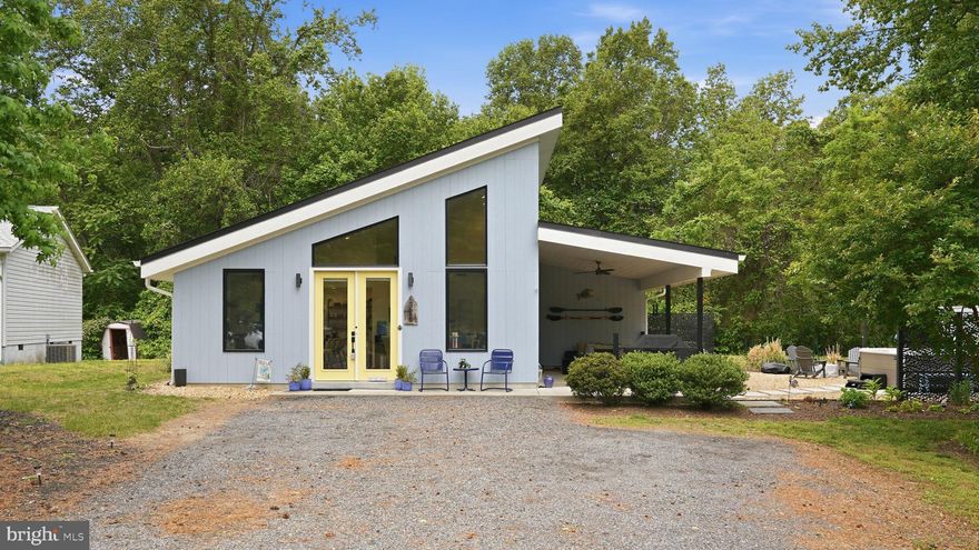 Stunning home designed by Beag+Haus and built in 2019 located in the waterfront neighborhood of Stratford Harbour*This home has a contemporary design with high ceilings and tall windows which create a light filled space and perfect for one level living*Beautiful modern kitchen has numerous upgrades including huge center island with granite, tile backsplash, Whirlpool "fingerprint resistant" kitchen appliances in bronze, upgraded cabinetry and luxury vinyl flooring*Master suite offers vaulted ceilings and luxury master bath with walk in shower, Duravit dual flush toilet and Duravit sink*Covered side porch creates an additional living/dining space and offers views of the cozy firepit and Hotsprings saltwater hot tub on a concrete pad landscaped with native plants*Electric car charger with additional panel as well! Adjacent lot available for purchase for $31,000 to build your dream garage or another home!