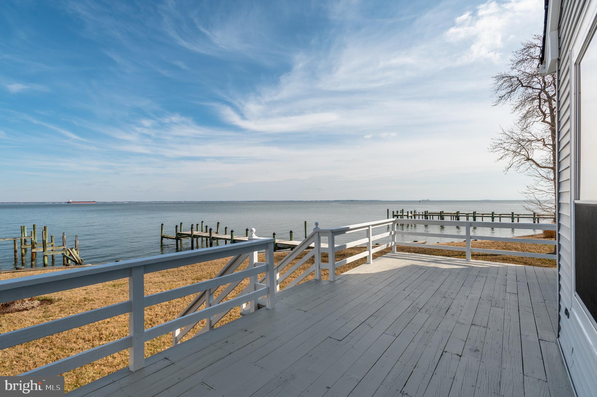 Amazing waterfront residence on the Chesapeake Bay with almost 360 degree water views of the Chesapeake Bay, Fishing Creek, and South River. Enjoy a quiet and friendly neighborhood with private beaches and a pier for your boat across the street. Never hassle with bay bridge traffic and enjoy a unique location which is 5 miles to downtown Annapolis, 5 minutes to major retail and restaurants, and a 45 minute drive to downtown Baltimore and Washington DC. The open floor plan provides a great room with cathedral ceilings, hardwood floors, an updated gourmet kitchen, a dining area, and a wood burning fireplace all with panoramic bay views of the bay bride and Thomas Point Light House. A deck off the great room provides a perfect spot to enjoy the bay breeze, to watch the water life of the Chesapeake, and to see spectacular sights of the stars and moon over the bay at night. Up a few steps, you will find the large master bedroom with en-suite bath, large walk-in closet, and views of Fishing Creek through large windows. 2 additional bedrooms, a 2nd full bath, and laundry closet complete this level. Ground level foyer, 2-car attached garage, and storage shed complete the property. 2+ year lease preferred. See agent notes for Tenant responsibility.